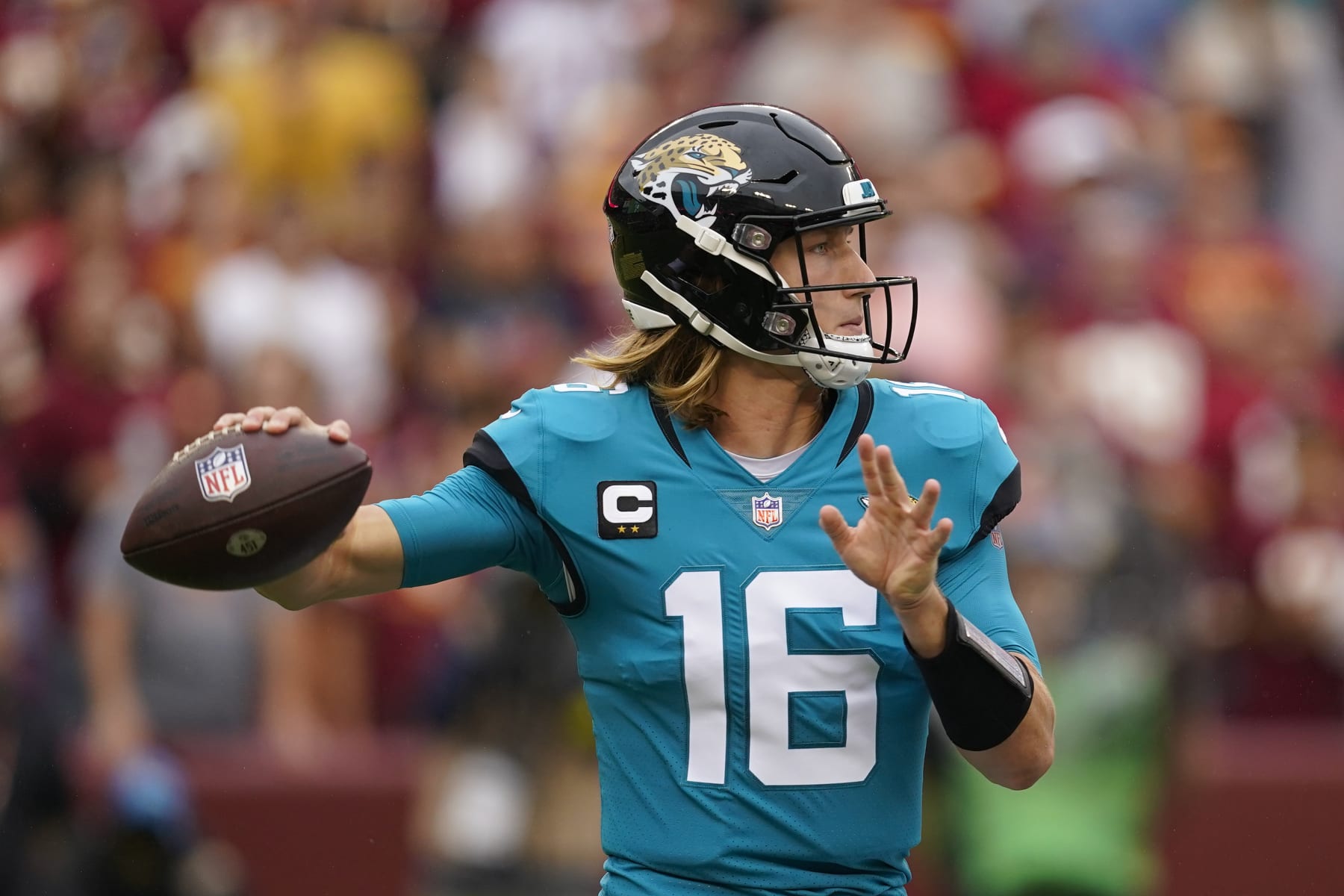 Jacksonville Jaguars quarterback Trevor Lawrence (16) throwing the ball against the Washington Commanders in the first half of an NFL football game, Sunday, Sept. 11, 2022, in Landover, Md. (AP Photo/Alex Brandon)