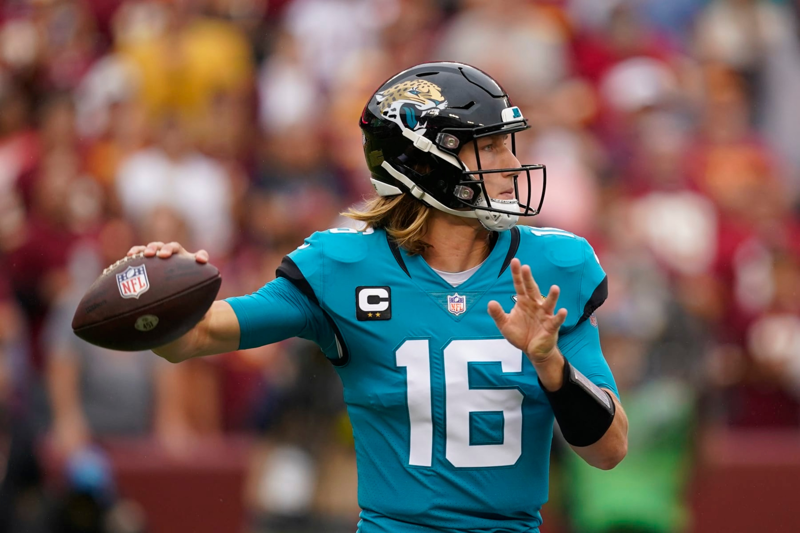 Jacksonville Jaguars quarterback Trevor Lawrence (16) throwing the ball against the Washington Commanders in the first half of an NFL football game, Sunday, Sept. 11, 2022, in Landover, Md. (AP Photo/Alex Brandon)