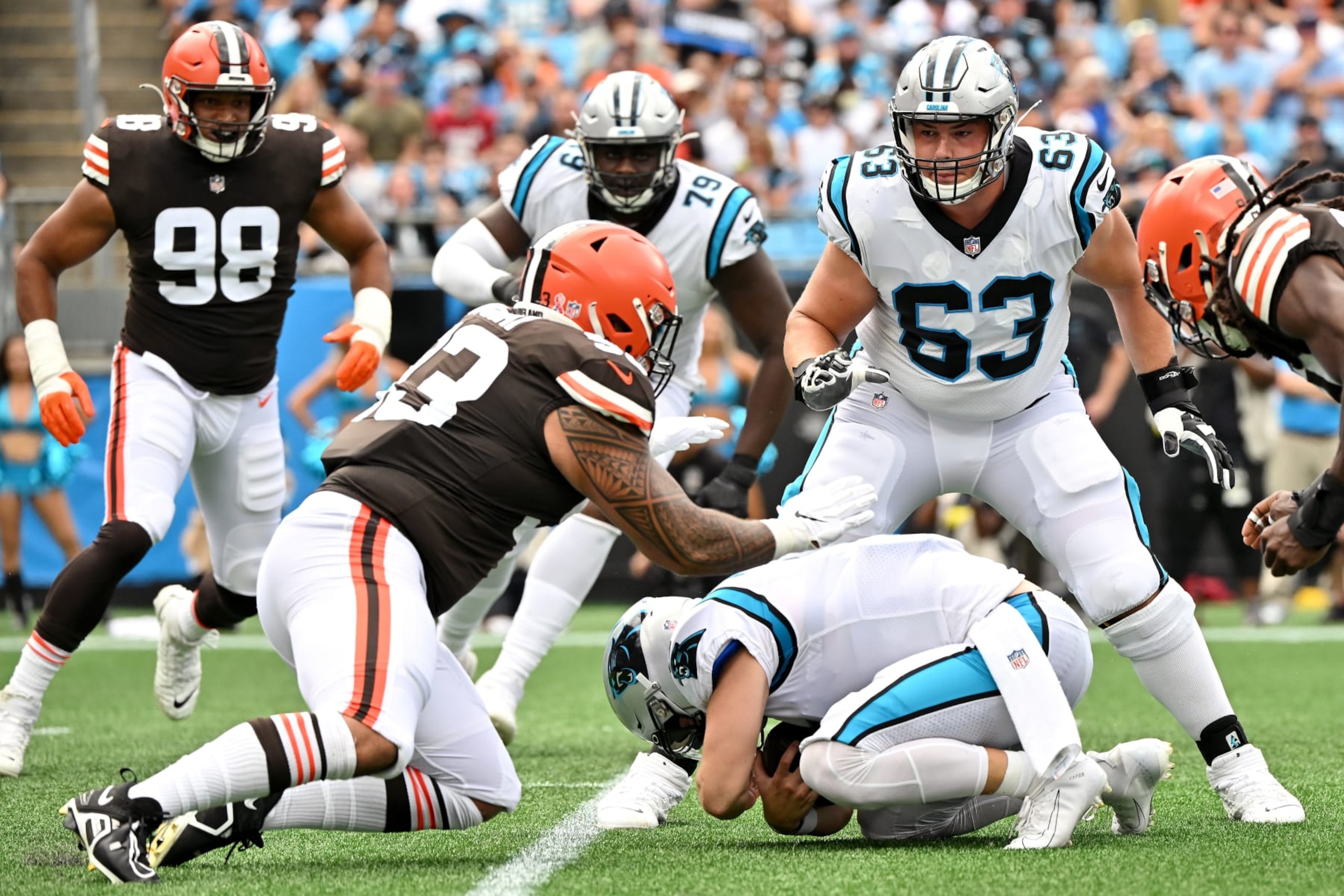 CHARLOTTE, NORTH CAROLINA - SEPTEMBER 11: Baker Mayfield #6 of the Carolina Panthers is sacked by Tommy Togiai #93 of the Cleveland Browns and Jadeveon Clowney #90 during the first half at Bank of America Stadium on September 11, 2022 in Charlotte, North Carolina. (Photo by Grant Halverson/Getty Images)