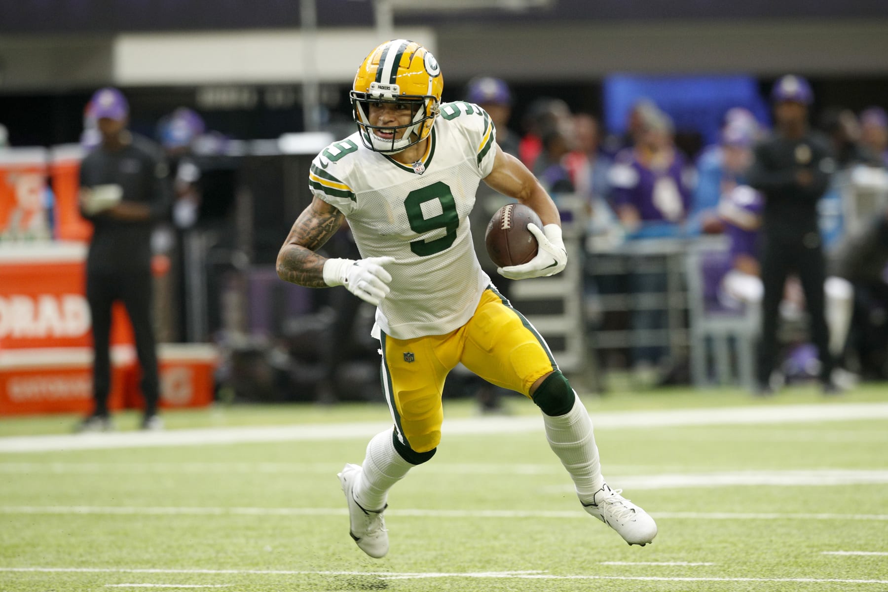 MINNEAPOLIS, MINNESOTA - SEPTEMBER 11: Christian Watson #9 of the Green Bay Packers runs the ball during the second quarter in the game against the Minnesota Vikings at U.S. Bank Stadium on September 11, 2022 in Minneapolis, Minnesota. (Photo by David Berding/Getty Images)