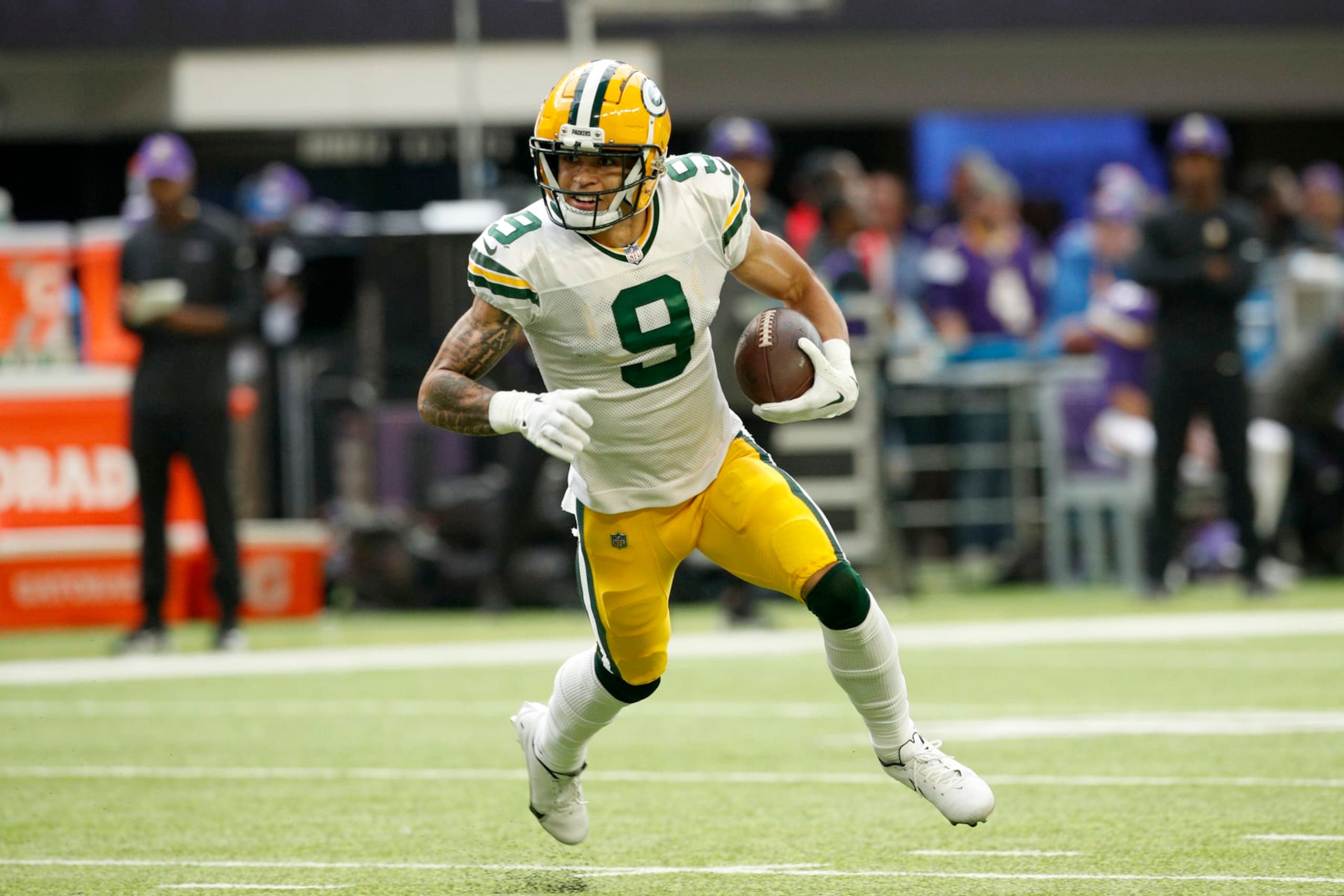 MINNEAPOLIS, MINNESOTA - SEPTEMBER 11: Christian Watson #9 of the Green Bay Packers runs the ball during the second quarter in the game against the Minnesota Vikings at U.S. Bank Stadium on September 11, 2022 in Minneapolis, Minnesota. (Photo by David Berding/Getty Images) MINNEAPOLIS, MINNESOTA - SEPTEMBER 11: Christian Watson #9 of the Green Bay Packers runs the ball during the second quarter in the game against the Minnesota Vikings at U.S. Bank Stadium on September 11, 2022 in Minneapolis, Minnesota. (Photo by David Berding/Getty Images)