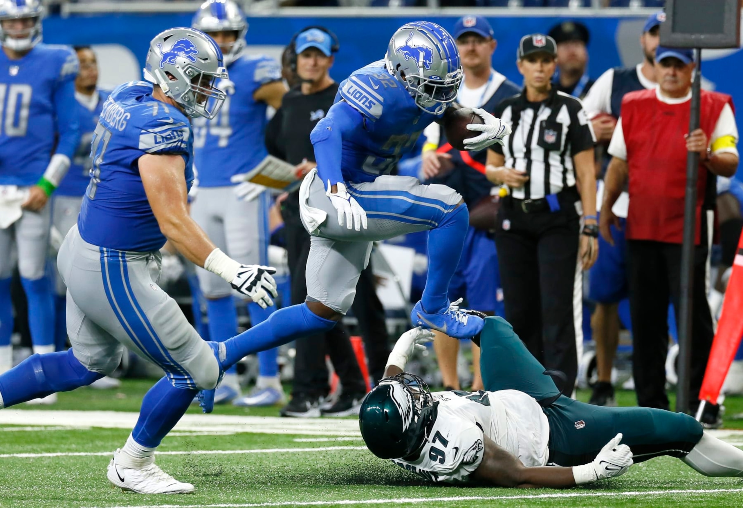 Detroit Lions running back D'Andre Swift (32) hurdles Philadelphia Eagles defensive tackle Javon Hargrave (97) with guard Logan Stenberg (71) blocking in the second half of an NFL football game in Detroit, Sunday, Sept. 11, 2022. (AP Photo/Duane Burleson) Detroit Lions running back D'Andre Swift (32) hurdles Philadelphia Eagles defensive tackle Javon Hargrave (97) with guard Logan Stenberg (71) blocking in the second half of an NFL football game in Detroit, Sunday, Sept. 11, 2022. (AP Photo/Duane Burleson)