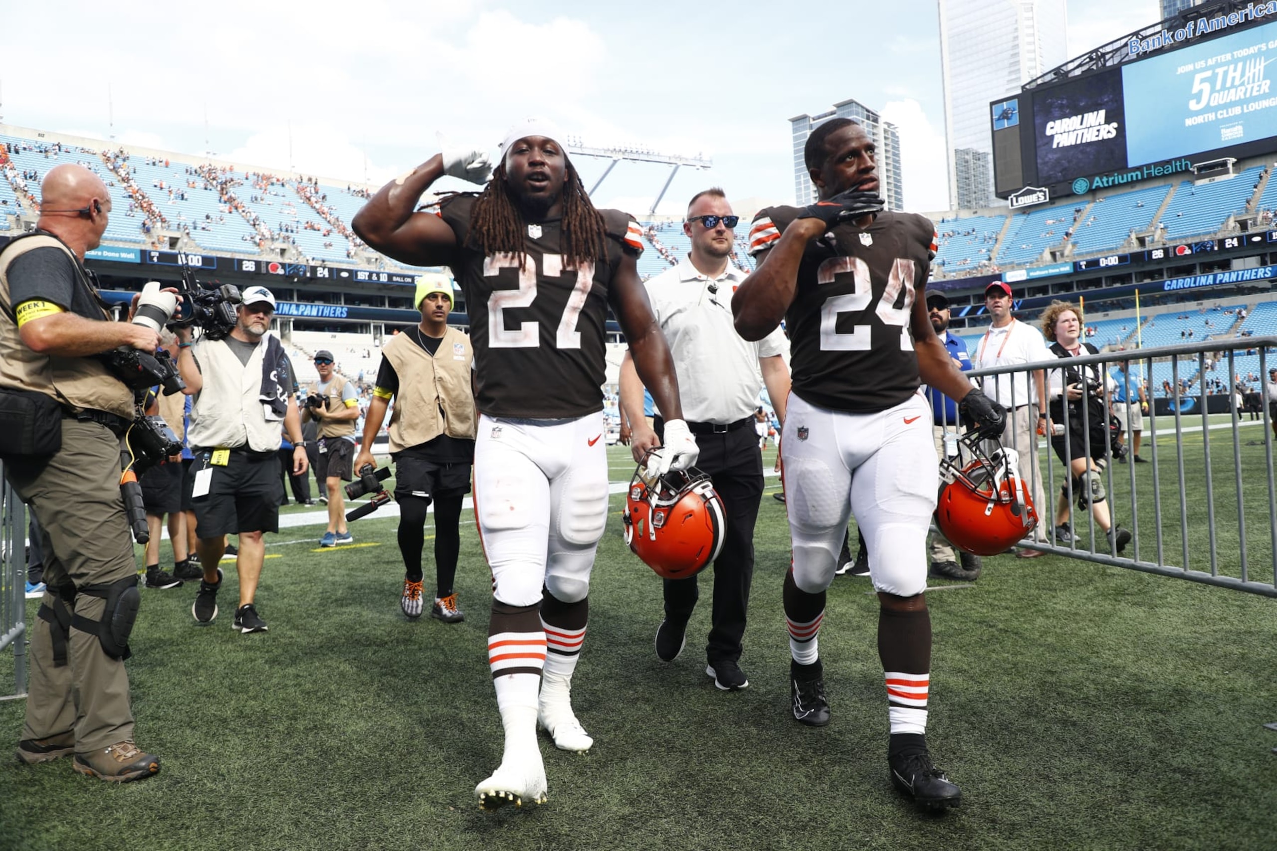 CHARLOTTE, NORTH CAROLINA - SEPTEMBER 11: Kareem Hunt #27 of the Cleveland Browns and Nick Chubb #24 leave the field after defeating the Carolina Panthers at Bank of America Stadium on September 11, 2022 in Charlotte, North Carolina. (Photo by Jared C. Tilton/Getty Images)