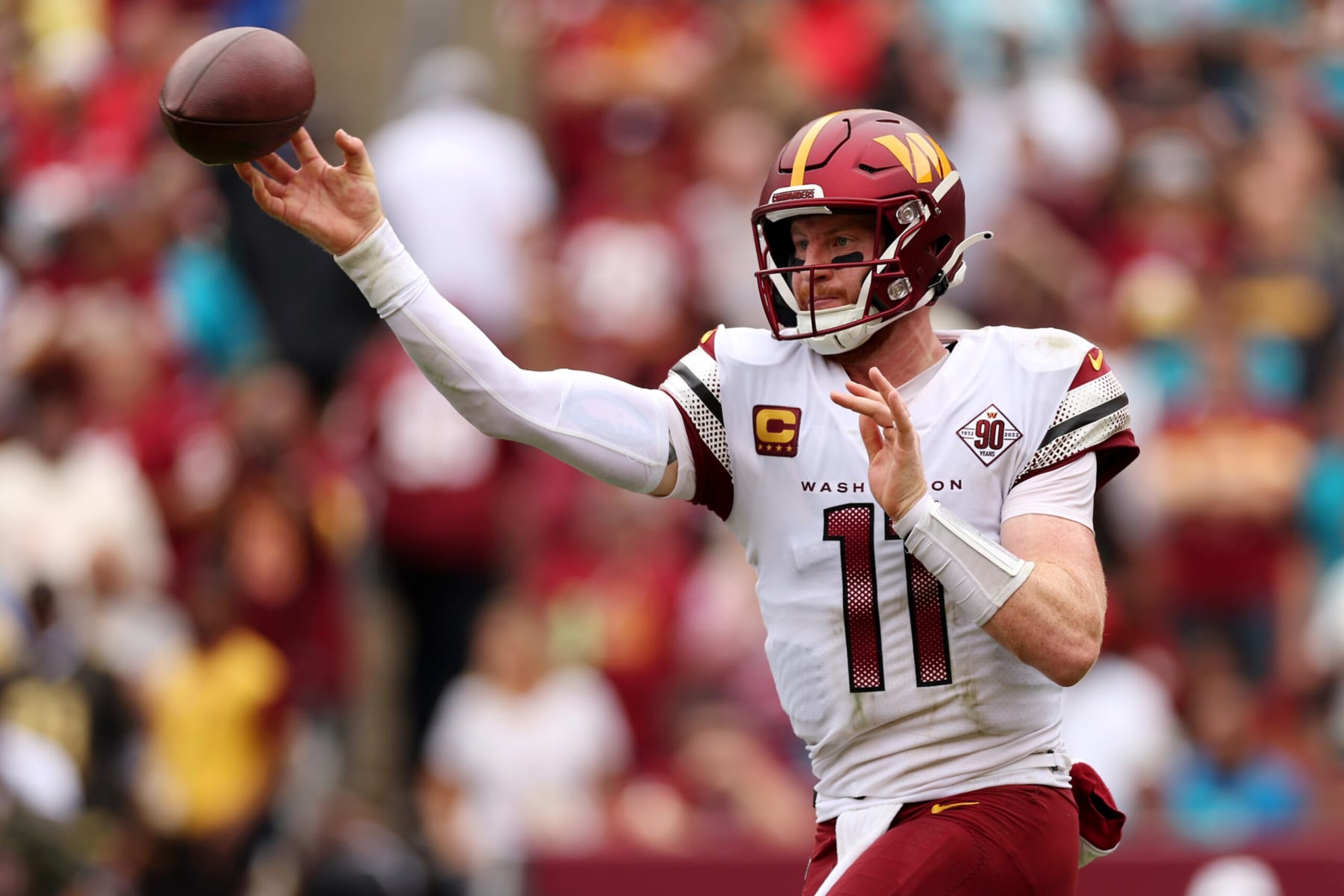 LANDOVER, MARYLAND - SEPTEMBER 11: Carson Wentz #11 of the Washington Commanders throws a pass during the first half against the Jacksonville Jaguars at FedExField on September 11, 2022 in Landover, Maryland. (Photo by Patrick Smith/Getty Images)