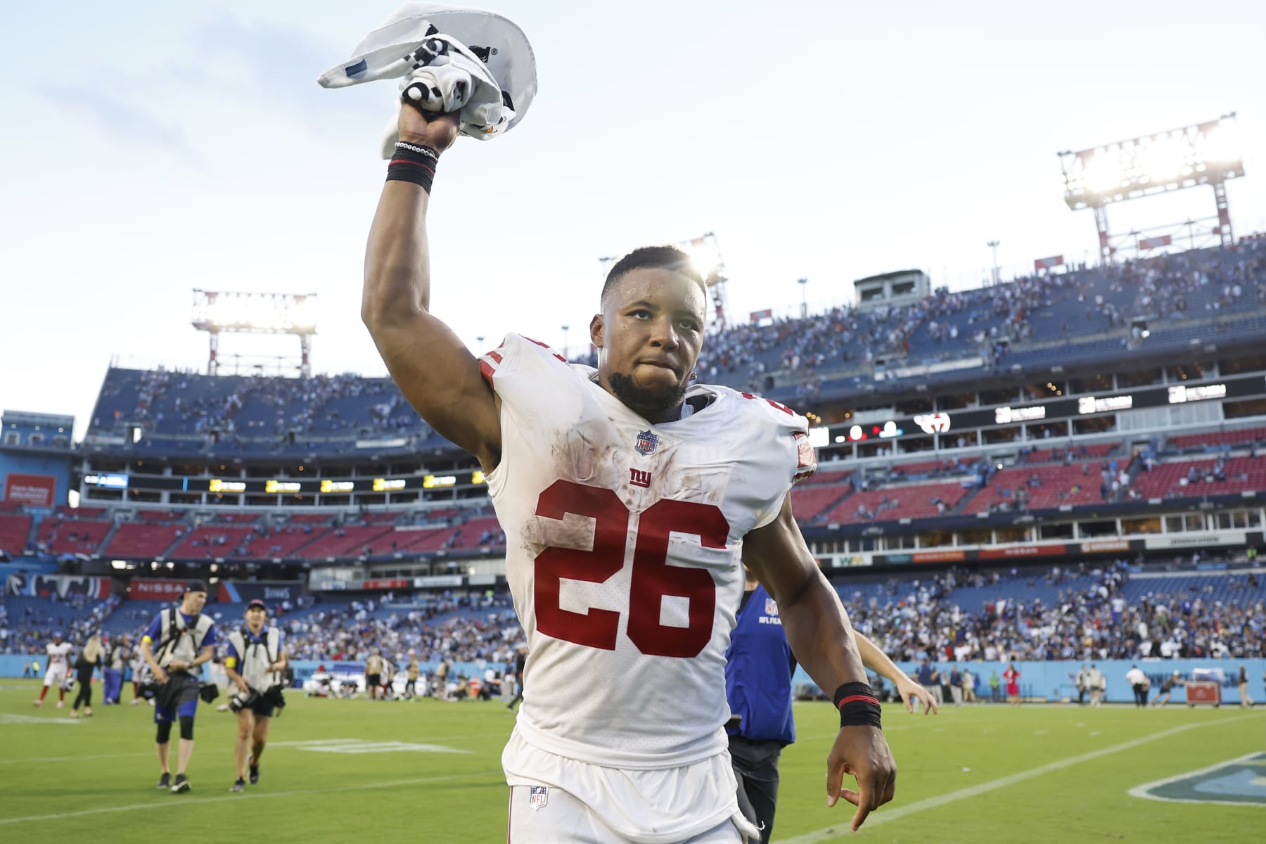 NASHVILLE, TENNESSEE - SEPTEMBER 11: Running back Saquon Barkley #26 of the New York Giants celebrates after his team's 21-20 victory against the Tennessee Titans at Nissan Stadium on September 11, 2022 in Nashville, Tennessee. (Photo by Wesley Hitt/Getty Images)