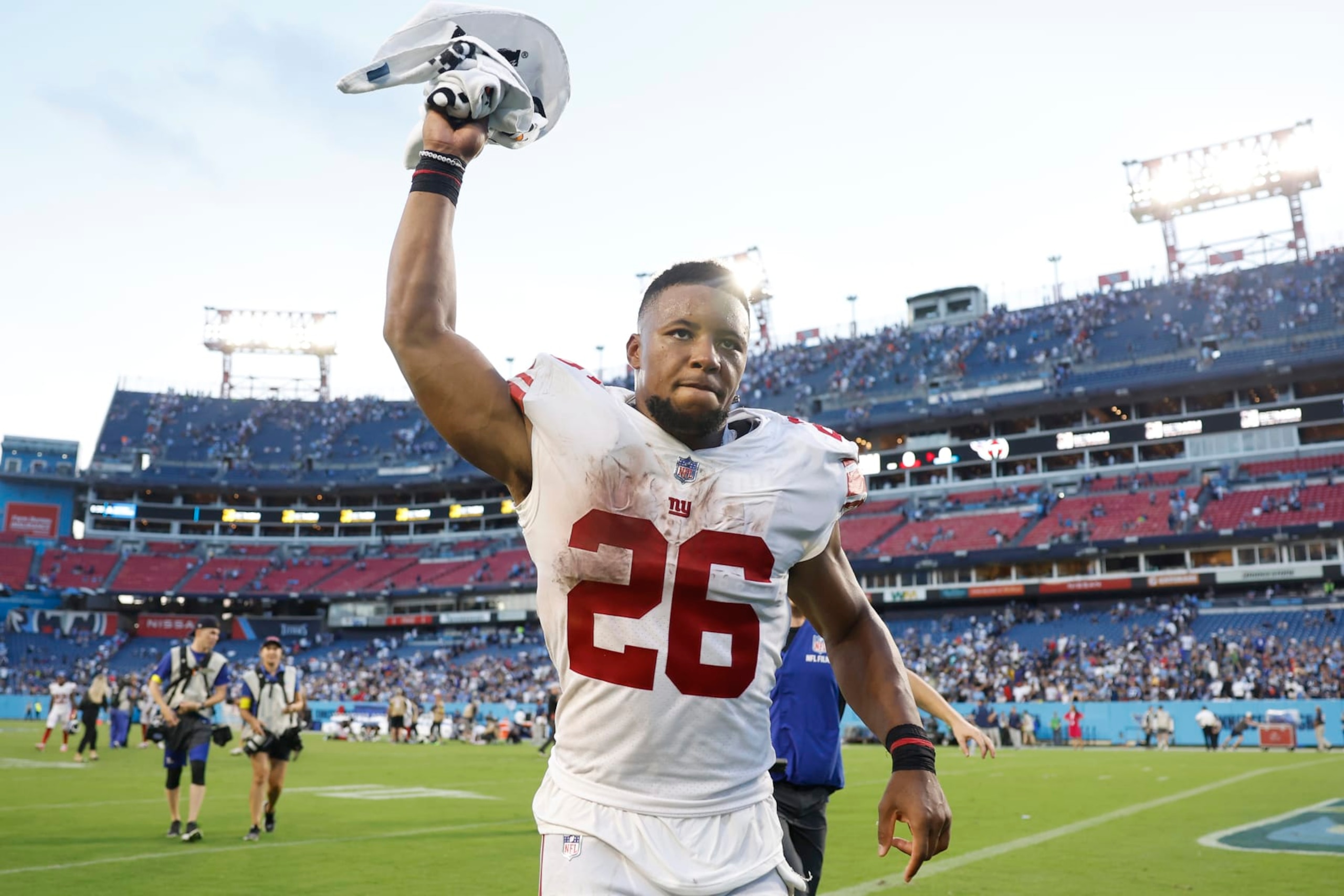 NASHVILLE, TENNESSEE - SEPTEMBER 11: Running back Saquon Barkley #26 of the New York Giants celebrates after his team's 21-20 victory against the Tennessee Titans at Nissan Stadium on September 11, 2022 in Nashville, Tennessee. (Photo by Wesley Hitt/Getty Images)