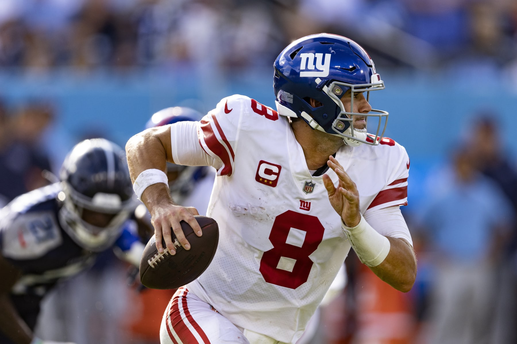 New York Giants quarterback Daniel Jones (8) rolls out to pass during their game against the Tennessee Titans Sunday, Sept. 11, 2022, in Nashville, Tenn. (AP Photo/Wade Payne)