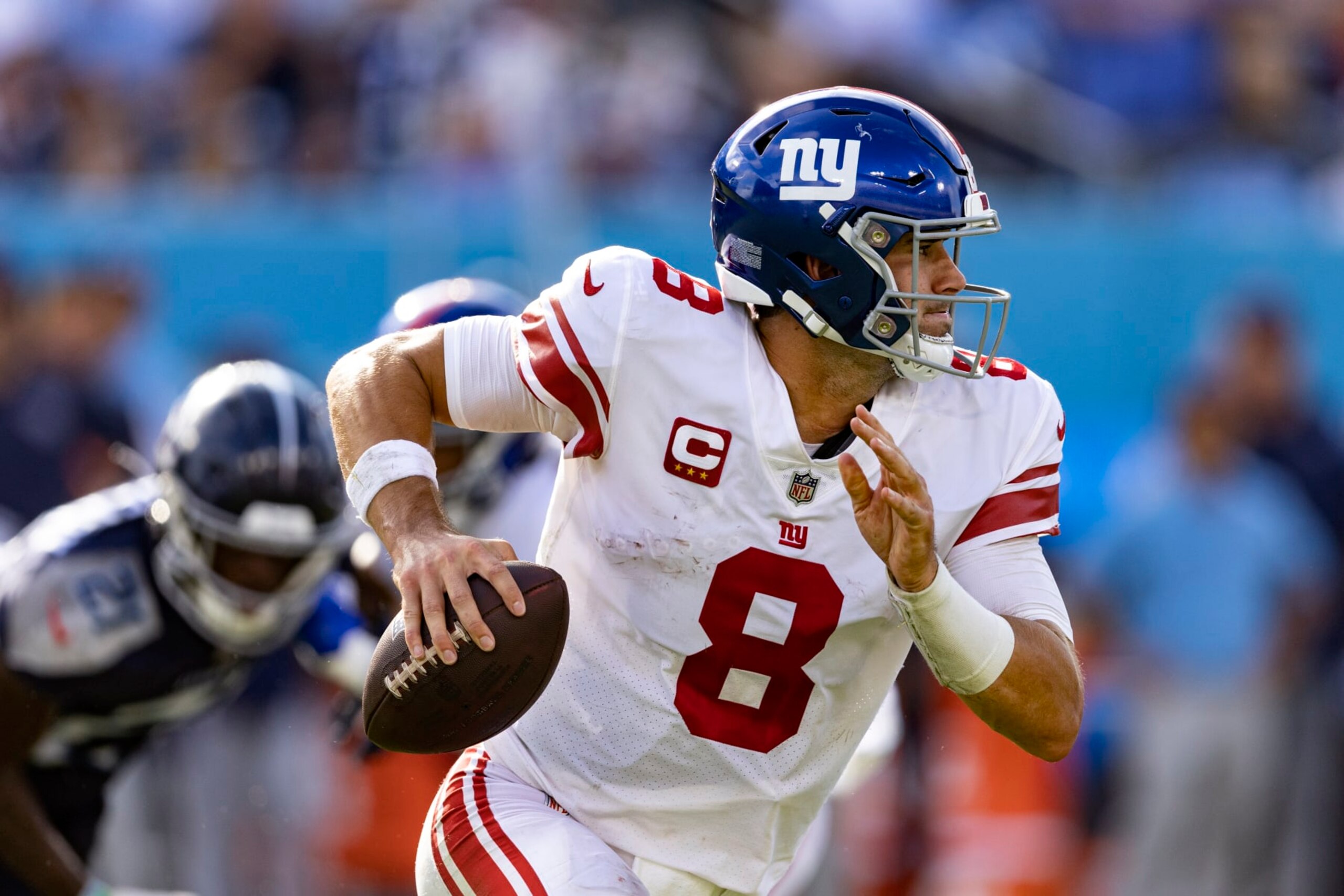 New York Giants quarterback Daniel Jones (8) rolls out to pass during their game against the Tennessee Titans Sunday, Sept. 11, 2022, in Nashville, Tenn. (AP Photo/Wade Payne)