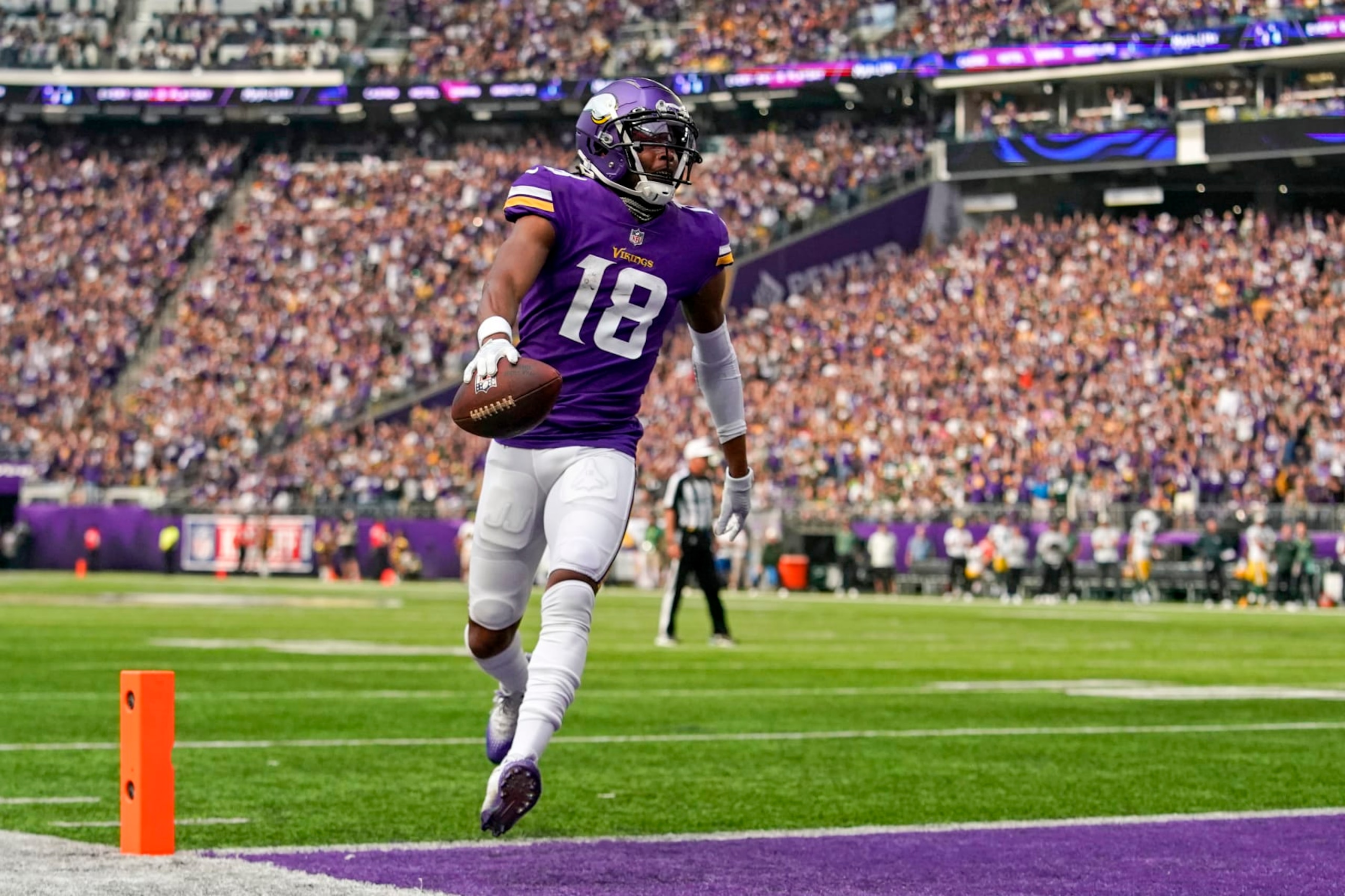 MINNEAPOLIS, MN - SEPTEMBER 11: Minnesota Vikings wide receiver Justin Jefferson (18) crosses the goal line for a touchdown after catching a 5-yard pass from Minnesota Vikings quarterback Kirk Cousins (8) during the first quarter of an NFL game between the Minnesota Vikings and Green Bay Packers on September 11, 2022 at U.S. Bank Stadium in Minneapolis, MN.(Photo by Nick Wosika/Icon Sportswire via Getty Images) MINNEAPOLIS, MN - SEPTEMBER 11: Minnesota Vikings wide receiver Justin Jefferson (18) crosses the goal line for a touchdown after catching a 5-yard pass from Minnesota Vikings quarterback Kirk Cousins (8) during the first quarter of an NFL game between the Minnesota Vikings and Green Bay Packers on September 11, 2022 at U.S. Bank Stadium in Minneapolis, MN.(Photo by Nick Wosika/Icon Sportswire via Getty Images)