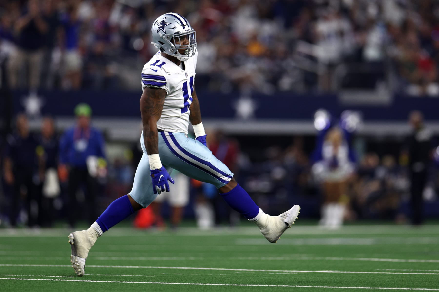 ARLINGTON, TEXAS - SEPTEMBER 11: Micah Parsons #11 of the Dallas Cowboys celebrates after sacking Tom Brady #12 of the Tampa Bay Buccaneers during the first half at AT&T Stadium on September 11, 2022 in Arlington, Texas. (Photo by Tom Pennington/Getty Images)