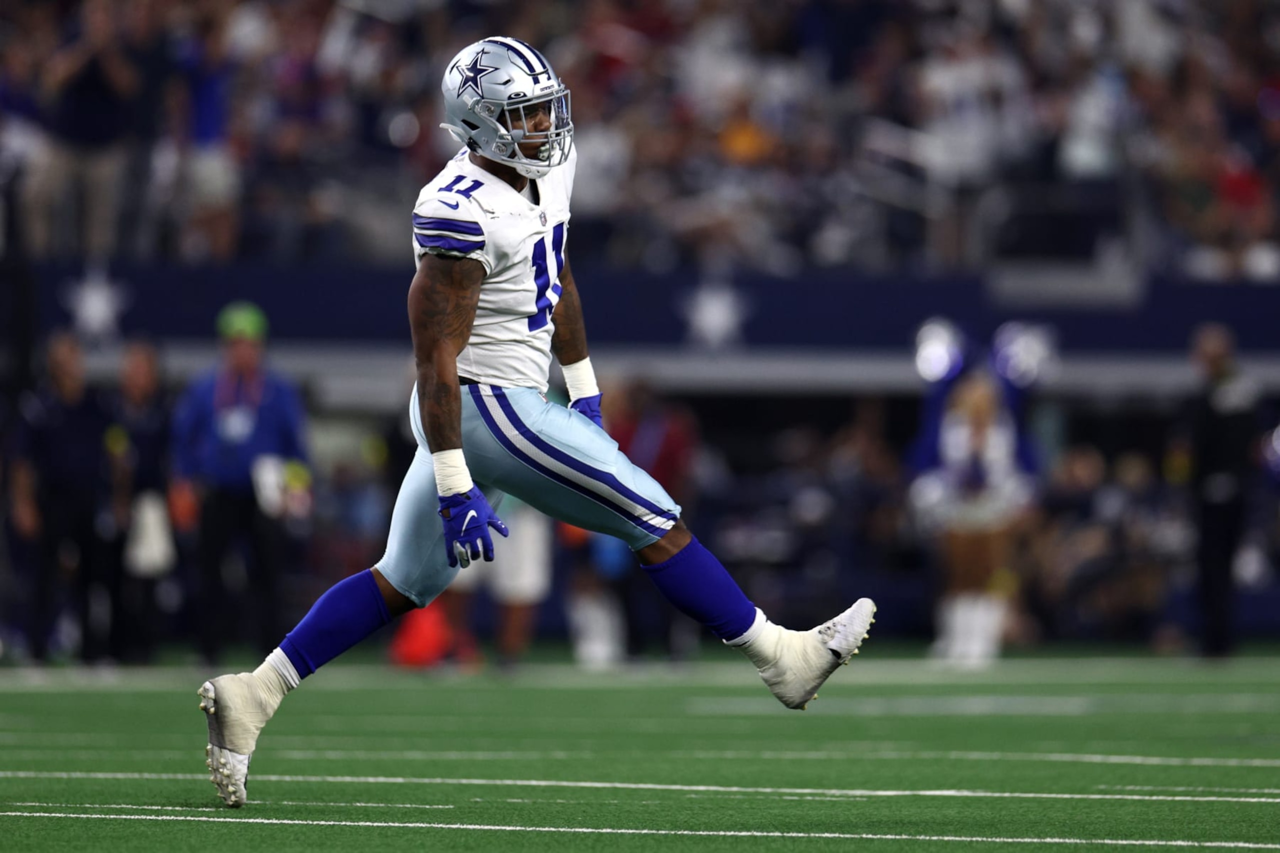 ARLINGTON, TEXAS - SEPTEMBER 11: Micah Parsons #11 of the Dallas Cowboys celebrates after sacking Tom Brady #12 of the Tampa Bay Buccaneers during the first half at AT&T Stadium on September 11, 2022 in Arlington, Texas. (Photo by Tom Pennington/Getty Images)