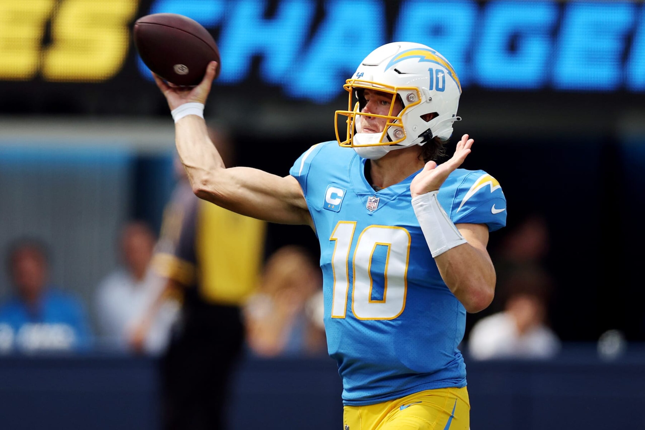 INGLEWOOD, CALIFORNIA - SEPTEMBER 11: Quarterback Justin Herbert #10 of the Los Angeles Chargers attempts a pass during the first half against the Las Vegas Raiders at SoFi Stadium on September 11, 2022 in Inglewood, California. (Photo by Harry How/Getty Images)