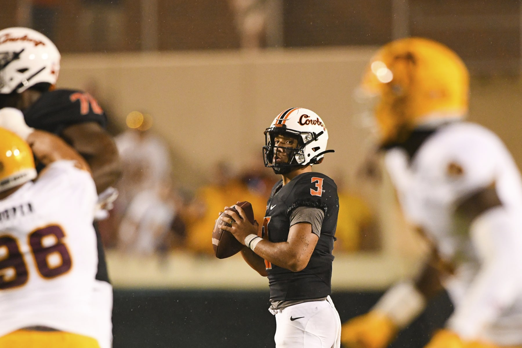 Oklahoma State quarterback Spencer Sanders (3) looks for an open teammate during the second half of an NCAA college football game against Arizona State, Saturday, Sept. 10, 2022, in Stillwater, Okla. (AP Photo/Brody Schmidt)