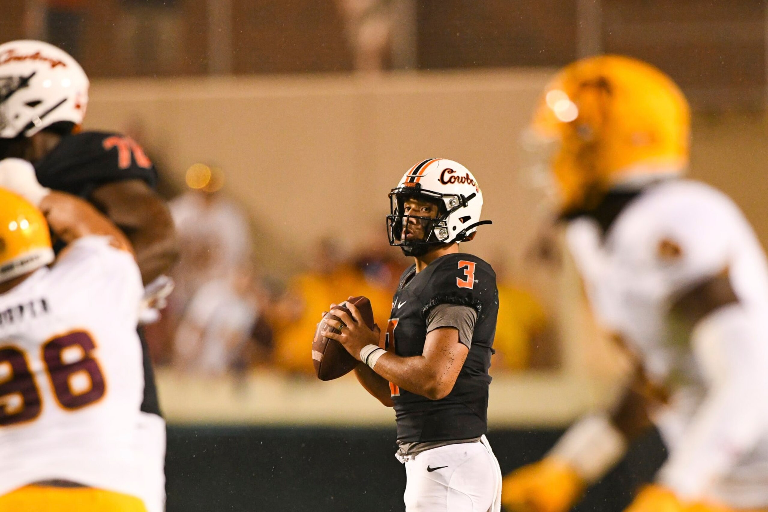 Oklahoma State quarterback Spencer Sanders (3) looks for an open teammate during the second half of an NCAA college football game against Arizona State, Saturday, Sept. 10, 2022, in Stillwater, Okla. (AP Photo/Brody Schmidt)