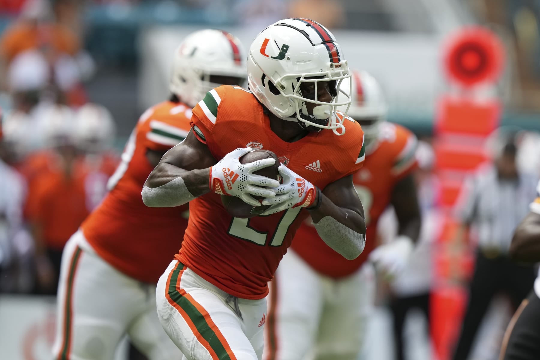 MIAMI GARDENS, FLORIDA - SEPTEMBER 10: Henry Parrish Jr. #21 of the Miami Hurricanes rushes the football during the first quarter against the Southern Miss Golden Eagles at Hard Rock Stadium on September 10, 2022 in Miami Gardens, Florida. (Photo by Eric Espada/Getty Images)