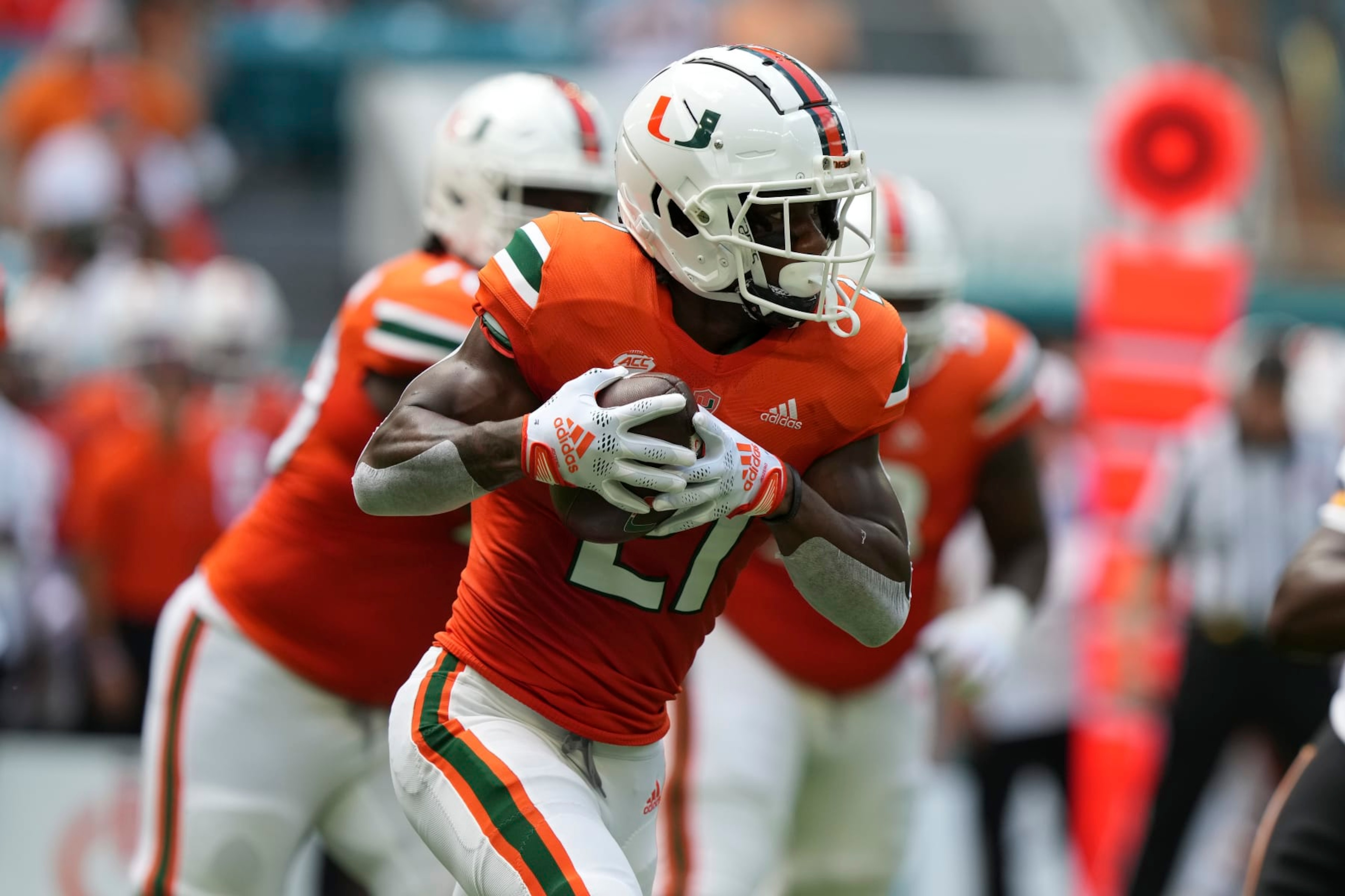 MIAMI GARDENS, FLORIDA - SEPTEMBER 10: Henry Parrish Jr. #21 of the Miami Hurricanes rushes the football during the first quarter against the Southern Miss Golden Eagles at Hard Rock Stadium on September 10, 2022 in Miami Gardens, Florida. (Photo by Eric Espada/Getty Images)