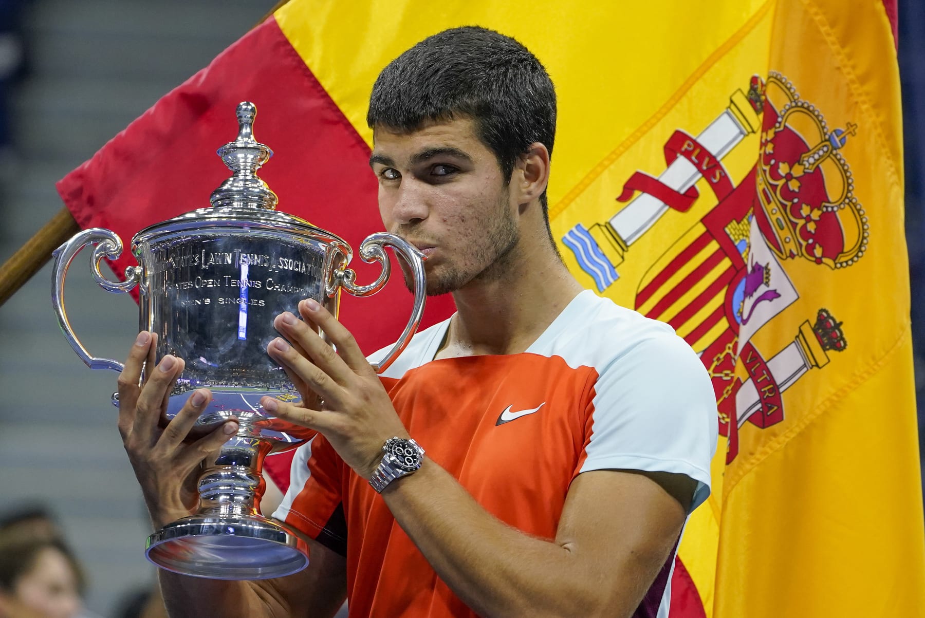 Carlos Alcaraz, of Spain, poses with the championship trophy after defeating Casper Ruud, of Norway, in the men's singles final of the U.S. Open tennis championships, Sunday, Sept. 11, 2022, in New York. (AP Photo/John Minchillo)