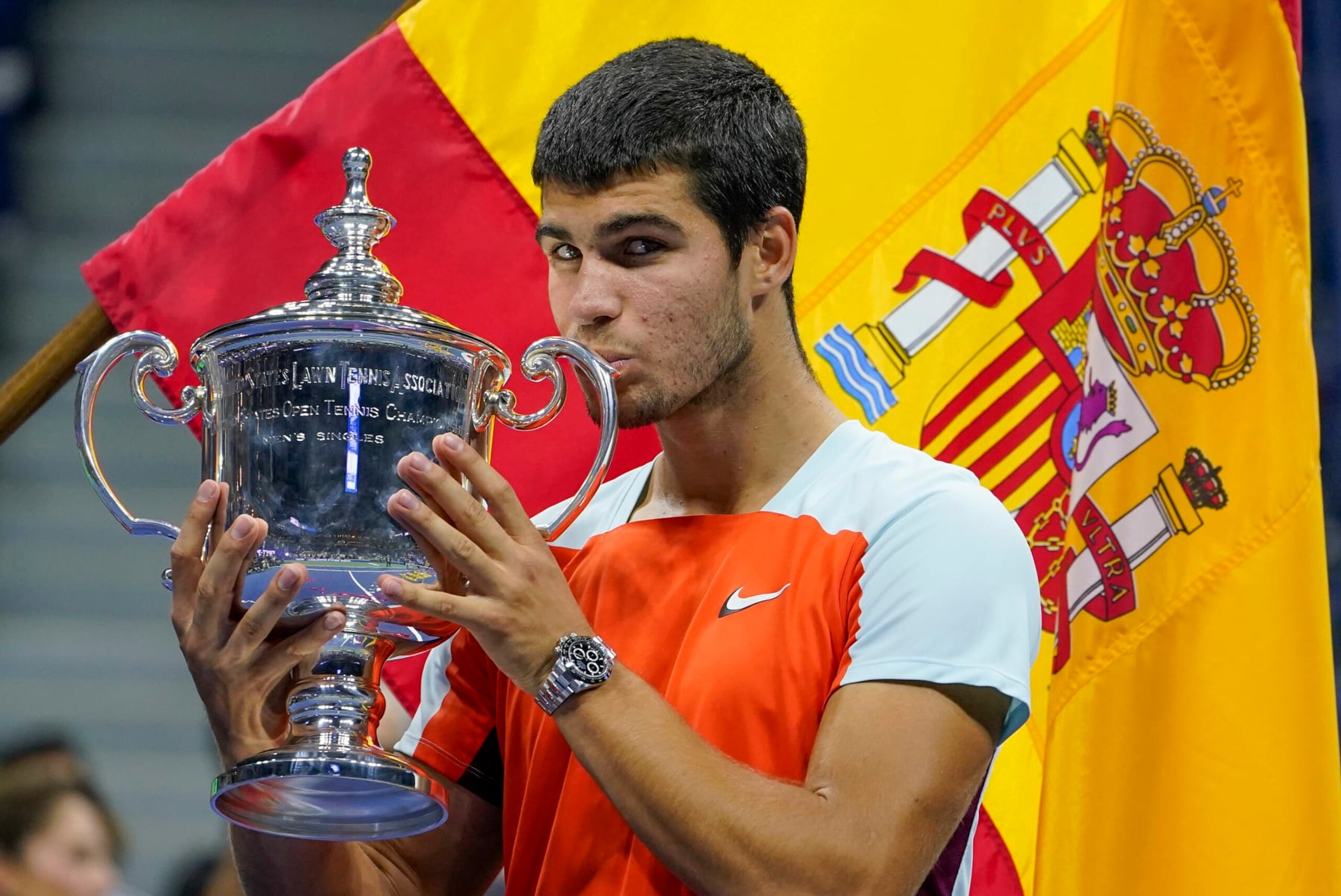 Carlos Alcaraz, of Spain, poses with the championship trophy after defeating Casper Ruud, of Norway, in the men's singles final of the U.S. Open tennis championships, Sunday, Sept. 11, 2022, in New York. (AP Photo/John Minchillo)