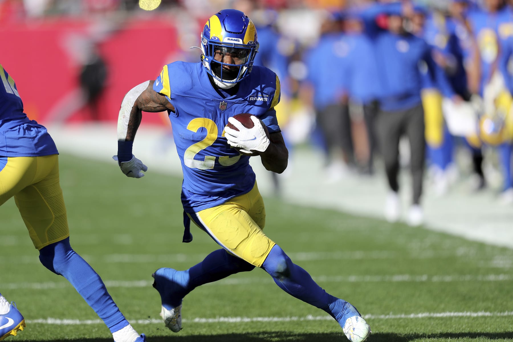 Los Angeles Rams running back Cam Akers (23) runs with the ball during a NFL divisional playoff football game between the Los Angeles Rams and Tampa Bay Buccaneers, Sunday, January 23, 2022 in Tampa, Fla. (AP Photo/Alex Menendez)