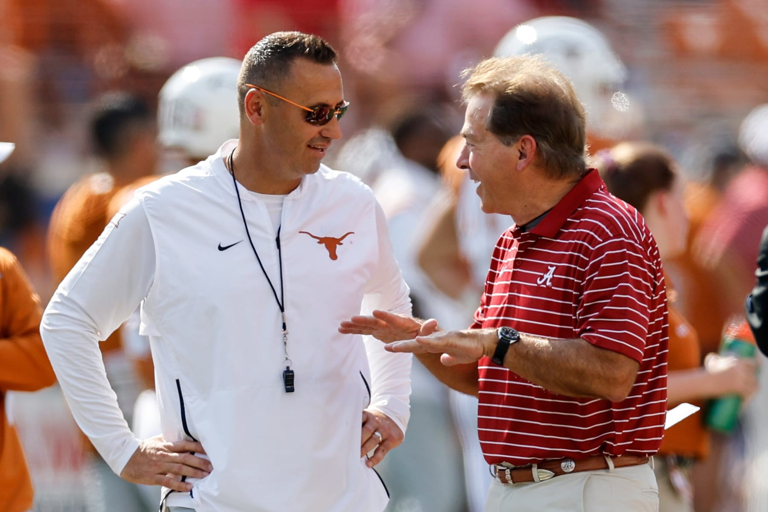 AUSTIN, TEXAS - SEPTEMBER 10: Head coach Steve Sarkisian of the Texas Longhorns talks with head coach Nick Saban of the Alabama Crimson Tide before the game at Darrell K Royal-Texas Memorial Stadium on September 10, 2022 in Austin, Texas. (Photo by Tim Warner/Getty Images) AUSTIN, TEXAS - SEPTEMBER 10: Head coach Steve Sarkisian of the Texas Longhorns talks with head coach Nick Saban of the Alabama Crimson Tide before the game at Darrell K Royal-Texas Memorial Stadium on September 10, 2022 in Austin, Texas. (Photo by Tim Warner/Getty Images)