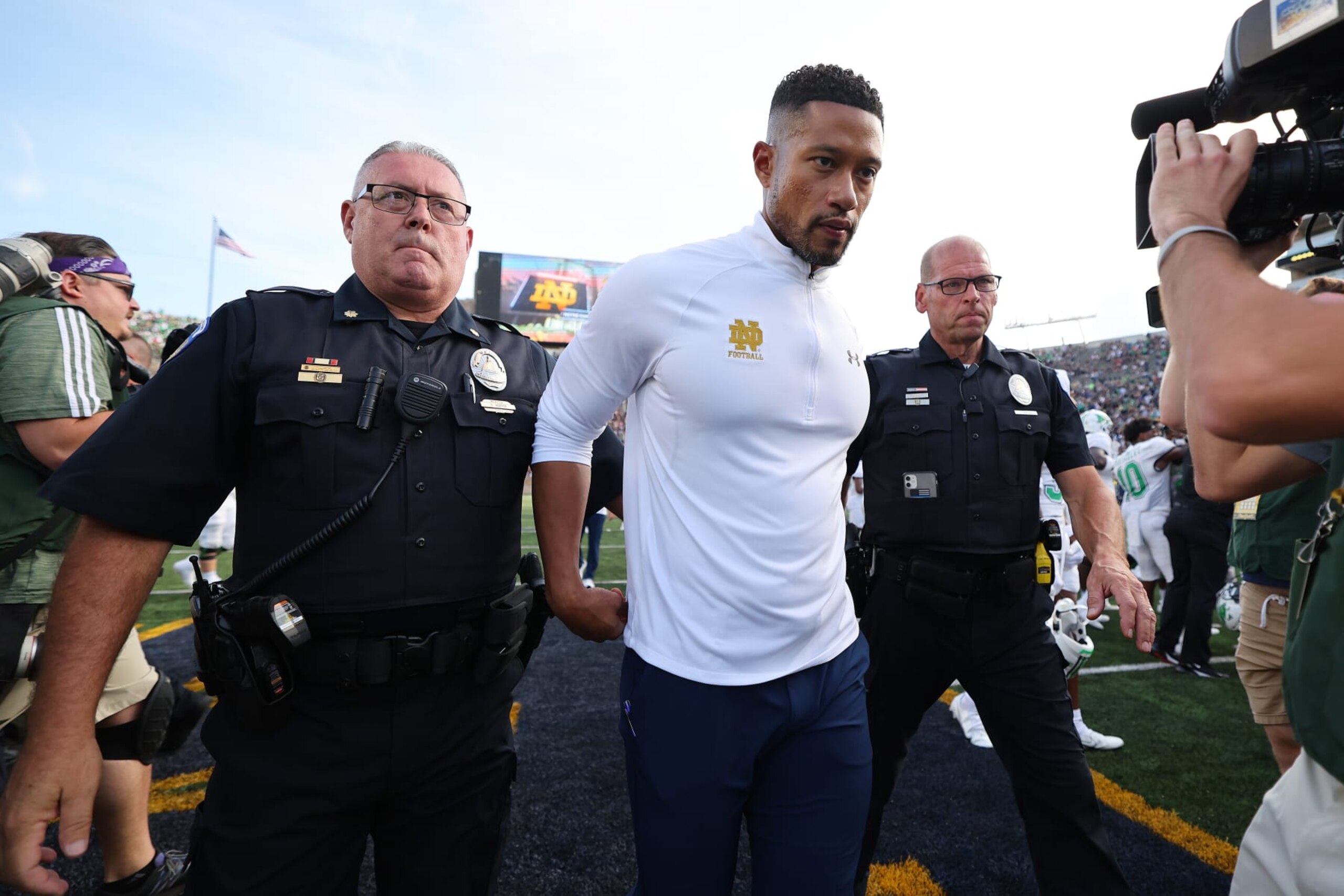 SOUTH BEND, INDIANA - SEPTEMBER 10: Head coach Marcus Freeman of the Notre Dame Fighting Irish walks off the field after losing to the Marshall Thundering Herd 26-21 at Notre Dame Stadium on September 10, 2022 in South Bend, Indiana. (Photo by Michael Reaves/Getty Images)