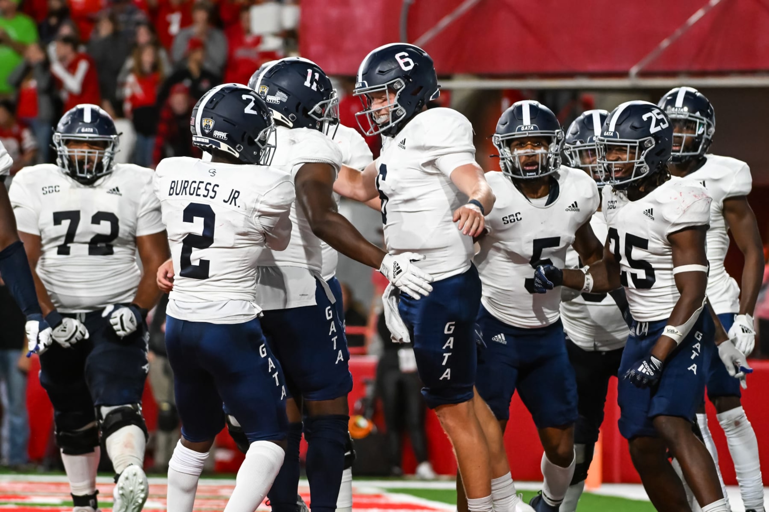 LINCOLN, NE - SEPTEMBER 10: Quarterback Kyle Vantrease #6 of the Georgia Southern Eagles celebrates with the offense after scoring the winning touchdown against the Nebraska Cornhuskers in the fourth quarter at Memorial Stadium on September 10, 2022 in Lincoln, Nebraska. (Photo by Steven Branscombe/Getty Images)