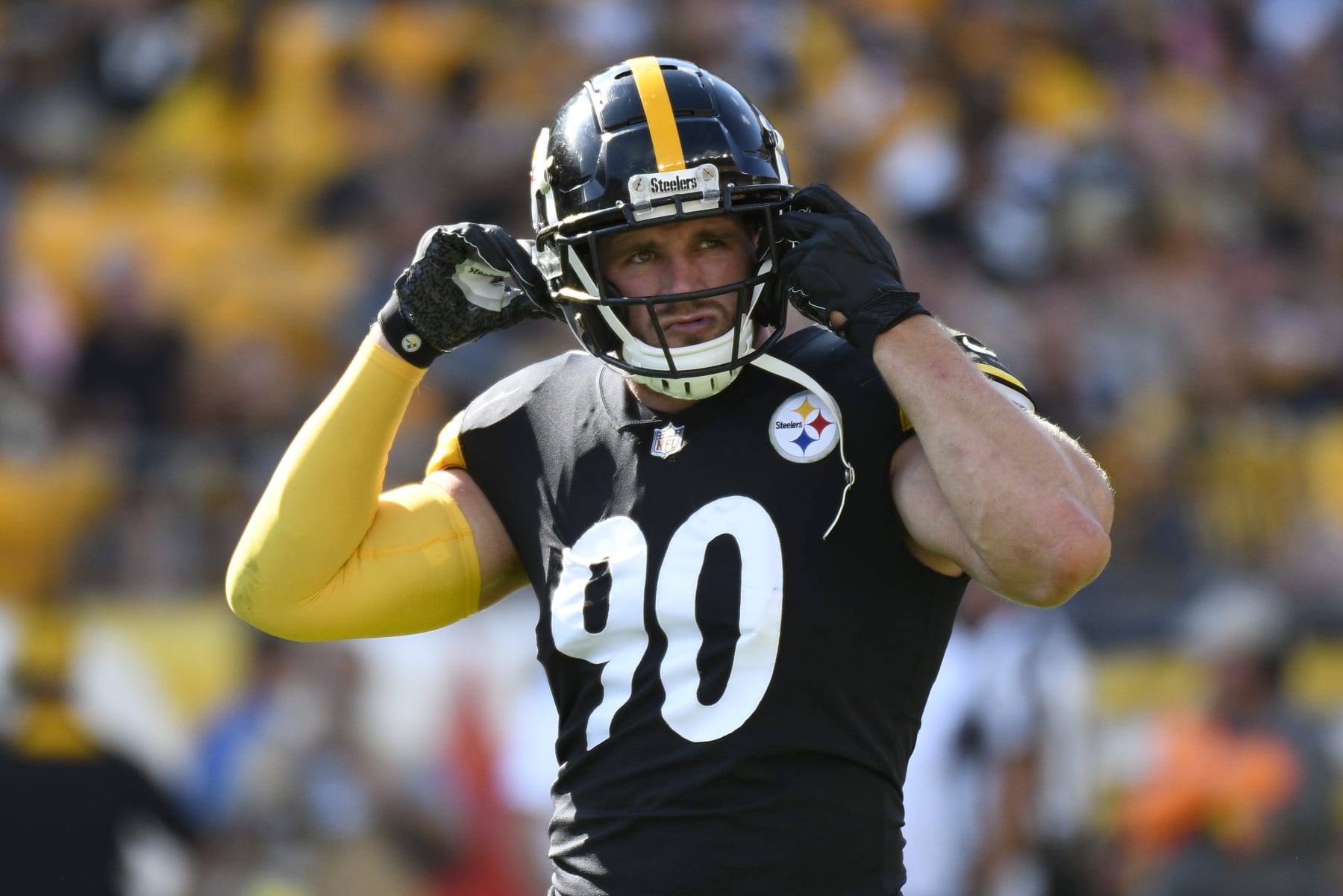 Pittsburgh Steelers linebacker T.J. Watt (90) buckles his helmet as he prepares to play against the Detroit Lions during the first half of an NFL preseason football game, Sunday, Aug. 28, 2022, in Pittsburgh. (AP Photo/Don Wright) Pittsburgh Steelers linebacker T.J. Watt (90) buckles his helmet as he prepares to play against the Detroit Lions during the first half of an NFL preseason football game, Sunday, Aug. 28, 2022, in Pittsburgh. (AP Photo/Don Wright)