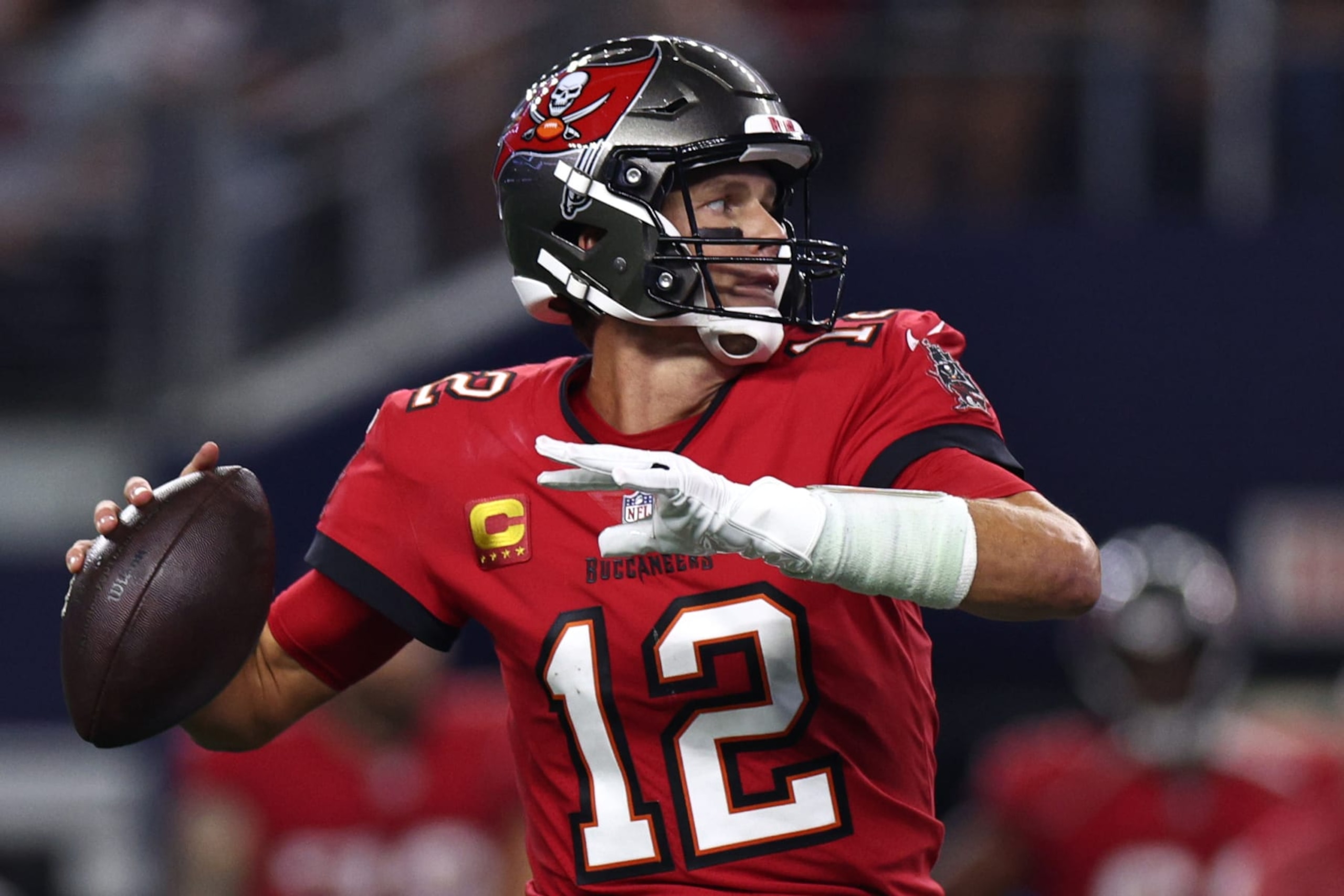 ARLINGTON, TEXAS - SEPTEMBER 11: Tom Brady #12 of the Tampa Bay Buccaneers makes a pass against the Dallas Cowboys during the first half at AT&T Stadium on September 11, 2022 in Arlington, Texas. (Photo by Tom Pennington/Getty Images) ARLINGTON, TEXAS - SEPTEMBER 11: Tom Brady #12 of the Tampa Bay Buccaneers makes a pass against the Dallas Cowboys during the first half at AT&T Stadium on September 11, 2022 in Arlington, Texas. (Photo by Tom Pennington/Getty Images)