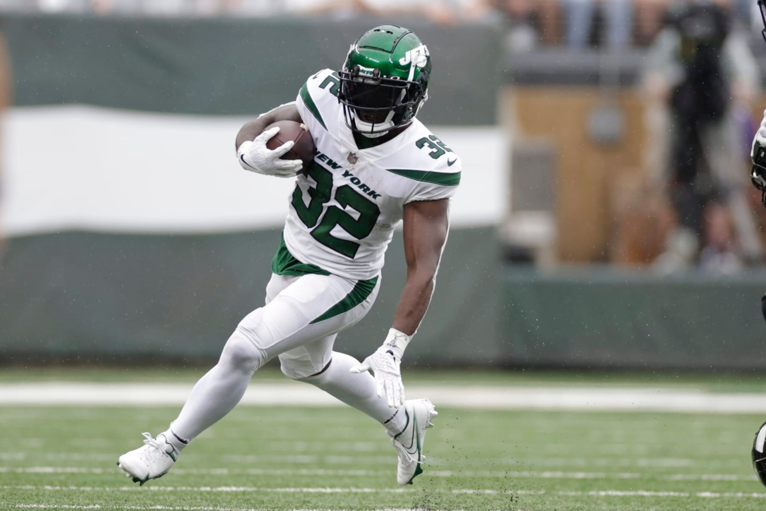 New York Jets' Michael Carter (32) rushes during the first half of an NFL football game against the Baltimore Ravens Sunday, Sept. 11, 2022, in East Rutherford, N.J. (AP Photo/Adam Hunger)