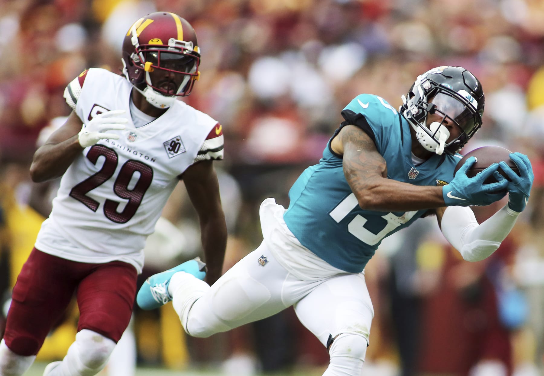 Jacksonville Jaguars wide receiver Christian Kirk (13) makes a catch during an NFL football game against the Washington Commanders, Sunday, Sept. 11, 2022 in Landover. (AP Photo/Daniel Kucin Jr.)