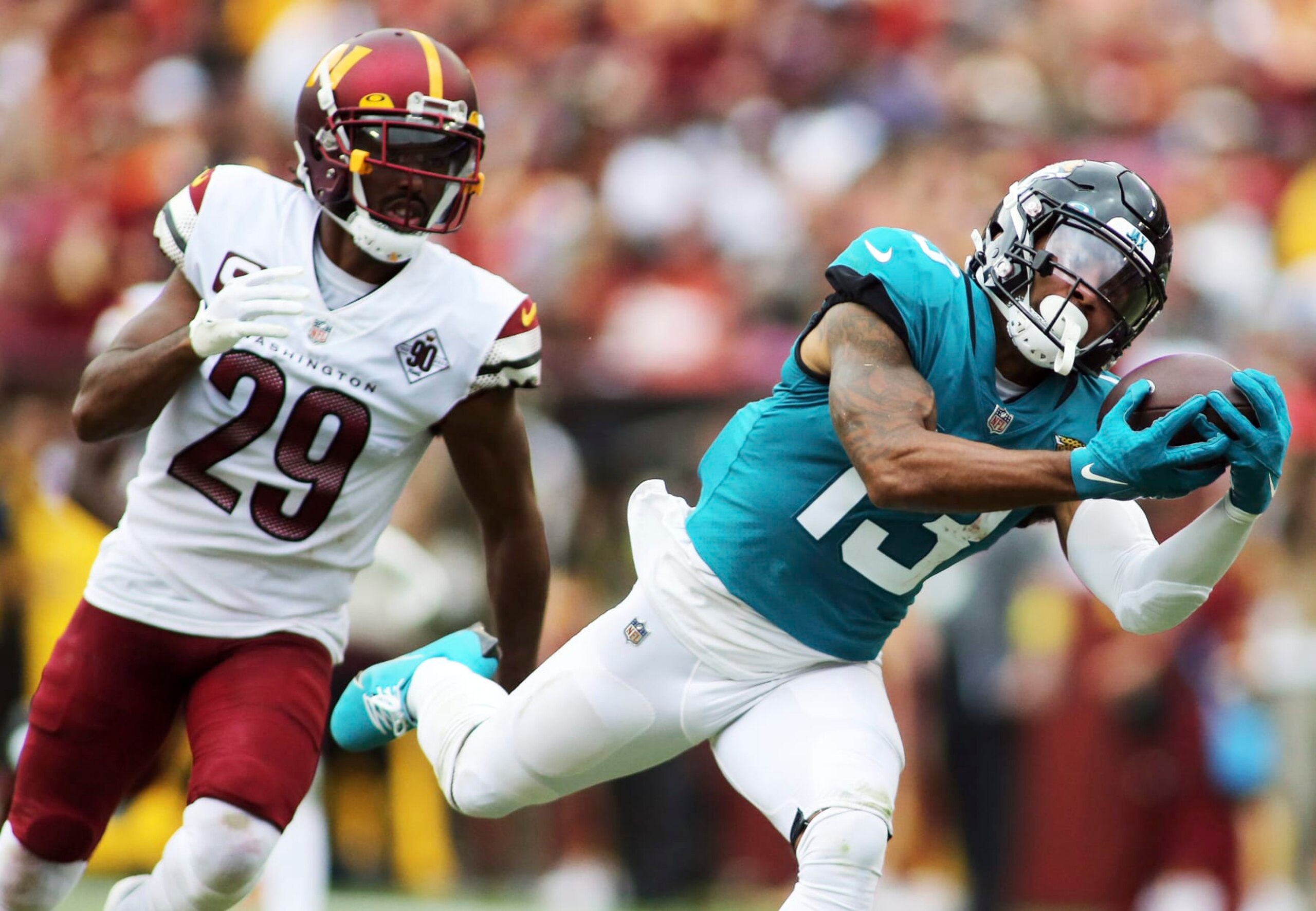 Jacksonville Jaguars wide receiver Christian Kirk (13) makes a catch during an NFL football game against the Washington Commanders, Sunday, Sept. 11, 2022 in Landover. (AP Photo/Daniel Kucin Jr.)