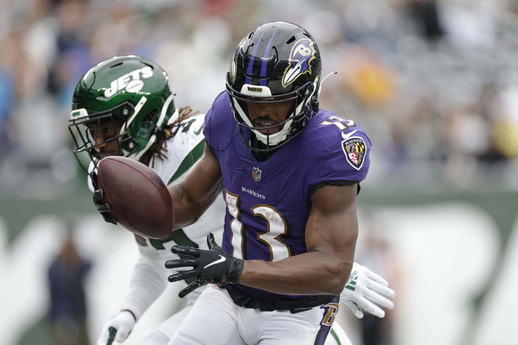 Baltimore Ravens' Devin Duvernay (13) runs past New York Jets' Tarik Black (3) for a touchdown during the second half of an NFL football game Sunday, Sept. 11, 2022, in East Rutherford, N.J. (AP Photo/Adam Hunger)