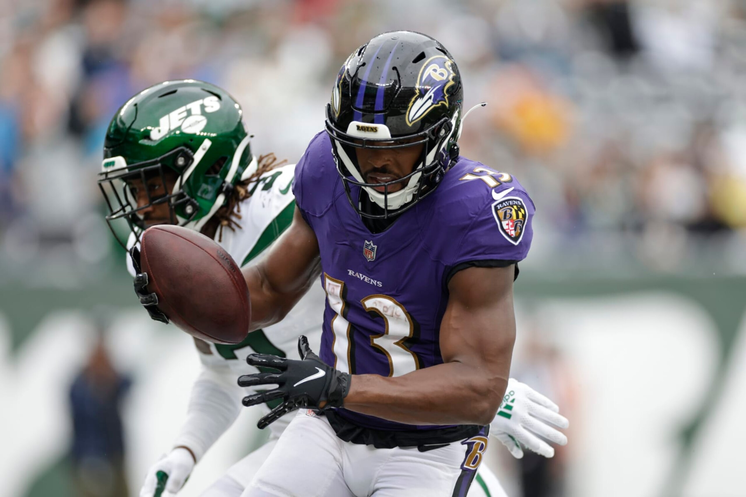 Baltimore Ravens' Devin Duvernay (13) runs past New York Jets' Tarik Black (3) for a touchdown during the second half of an NFL football game Sunday, Sept. 11, 2022, in East Rutherford, N.J. (AP Photo/Adam Hunger)