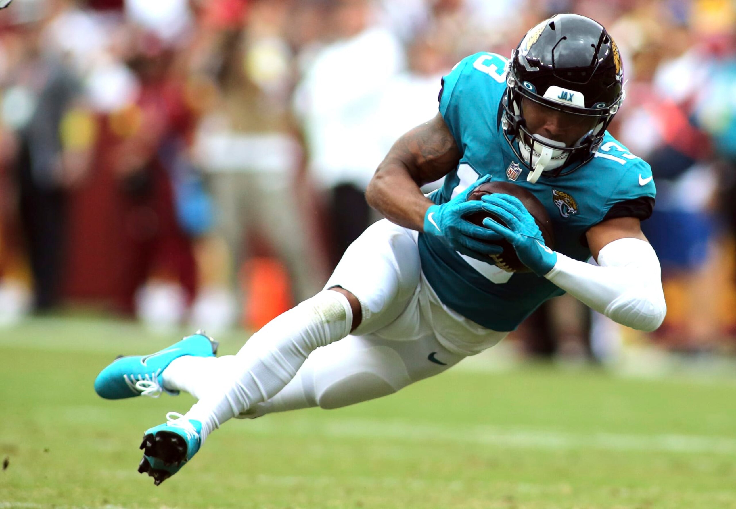 Jacksonville Jaguars wide receiver Christian Kirk (13) makes a catch during an NFL football game against the Washington Commanders, Sunday, Sept. 11, 2022 in Landover. (AP Photo/Daniel Kucin Jr.)