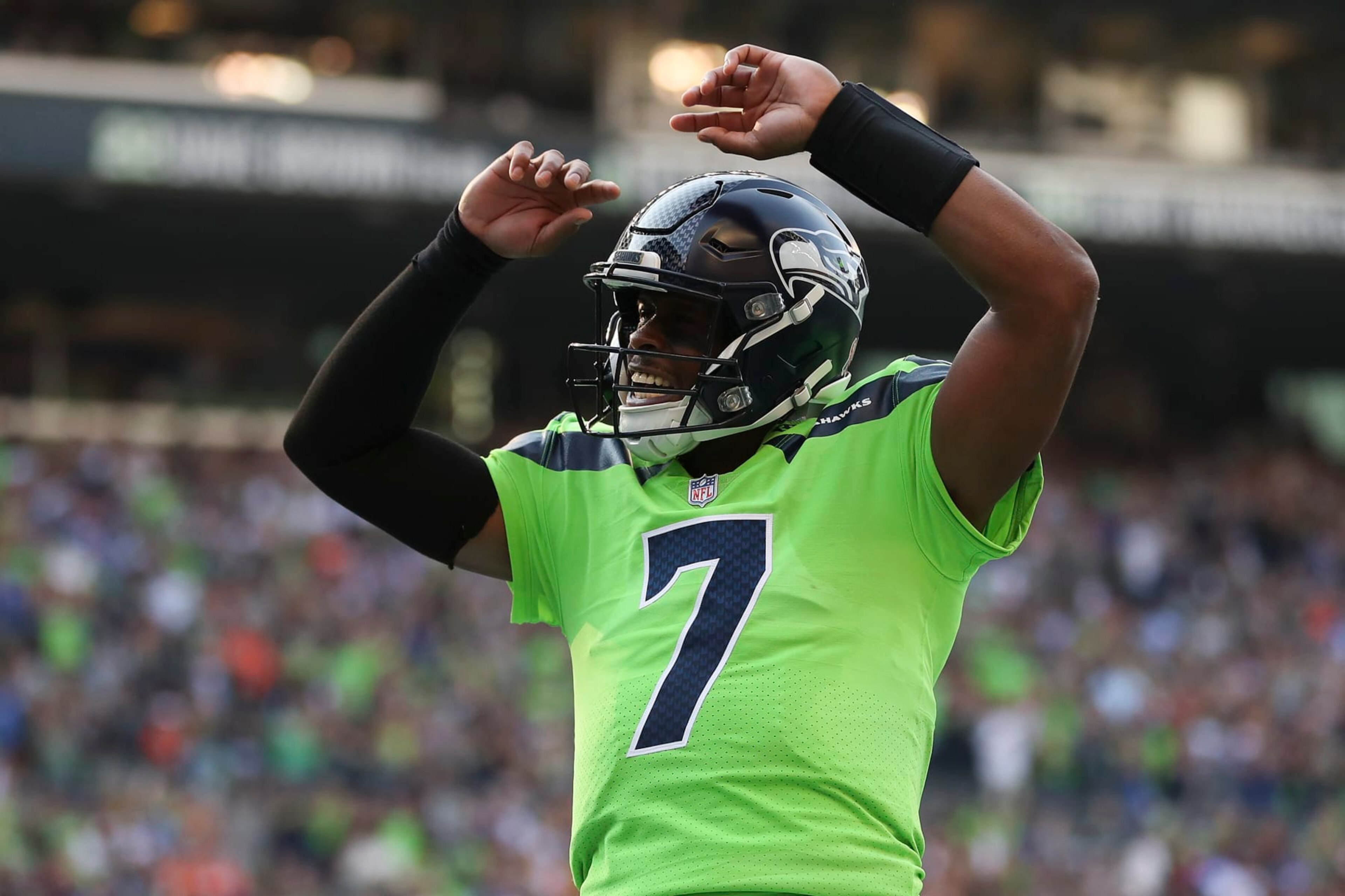 SEATTLE, WASHINGTON - SEPTEMBER 12: Geno Smith #7 of the Seattle Seahawks celebrates during the first quarter against the Denver Broncos at Lumen Field on September 12, 2022 in Seattle, Washington. (Photo by Steph Chambers/Getty Images) SEATTLE, WASHINGTON - SEPTEMBER 12: Geno Smith #7 of the Seattle Seahawks celebrates during the first quarter against the Denver Broncos at Lumen Field on September 12, 2022 in Seattle, Washington. (Photo by Steph Chambers/Getty Images)