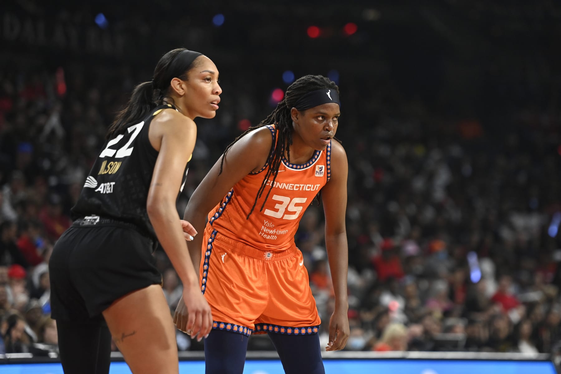 LAS VEGAS, NV - SEPTEMBER 11: Jonquel Jones #35 of the Connecticut Sun and Aja Wilson #22 of the Las Vegas Aces look on during Game 1 of the 2022 WNBA Finals on September 11, 2022 at  Michelob ULTRA Arena in Las Vegas, Nevada. NOTE TO USER: User expressly acknowledges and agrees that, by downloading and or using this photograph, User is consenting to the terms and conditions of the Getty Images License Agreement. Mandatory Copyright Notice: Copyright 2022 NBAE (Photo by David Becker/NBAE via Getty Images)