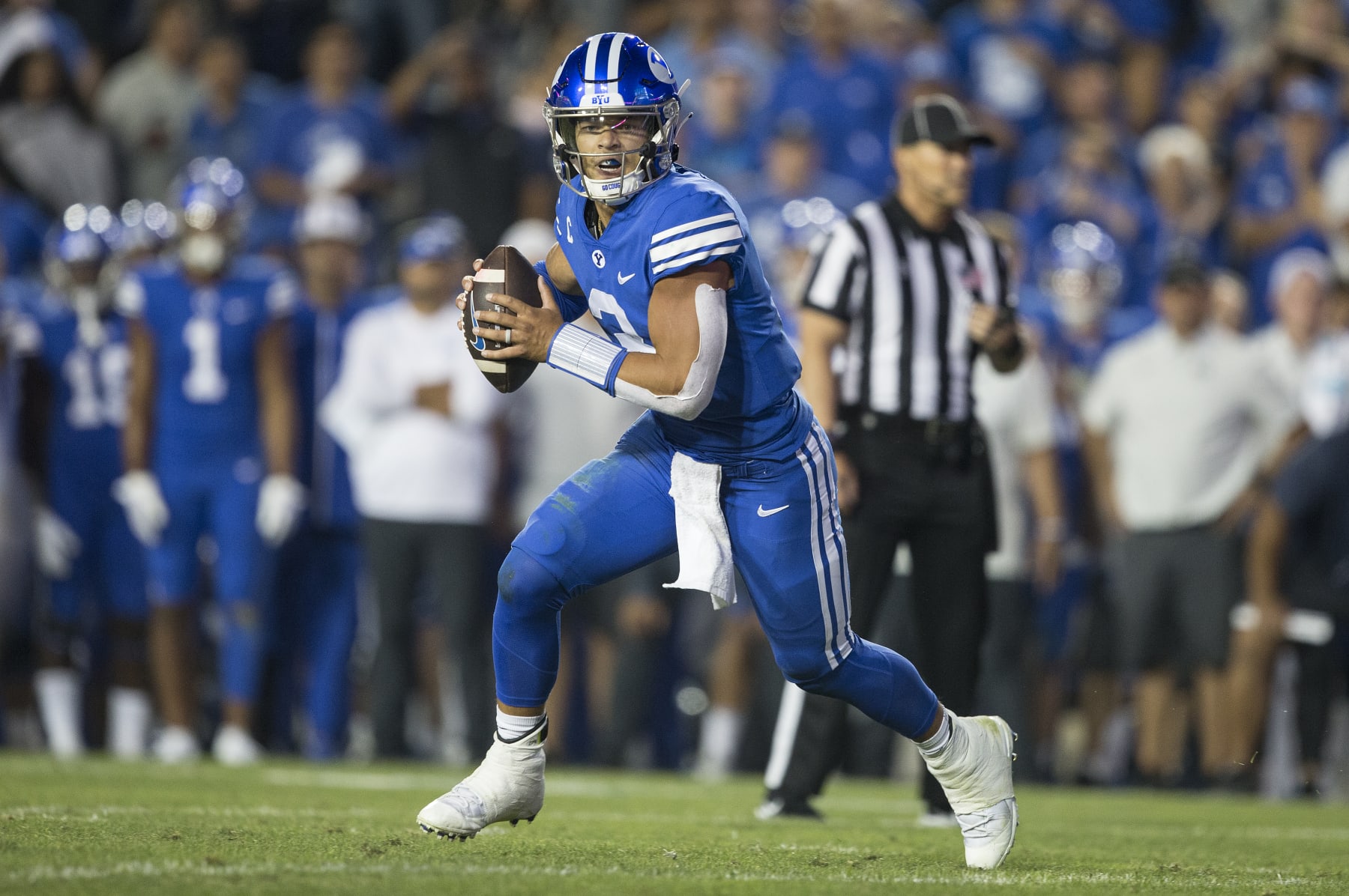 PROVO, UT- SEPTEMBER 10:  Jaren Hall #3 of the Brigham Young Cougars rolls out of the pocket to pass during the second overtime period against the Baylor Bears at LaVell Edwards Stadium on September 10, 2022 in Provo, Utah. (Photo by Chris Gardner/Getty Images)