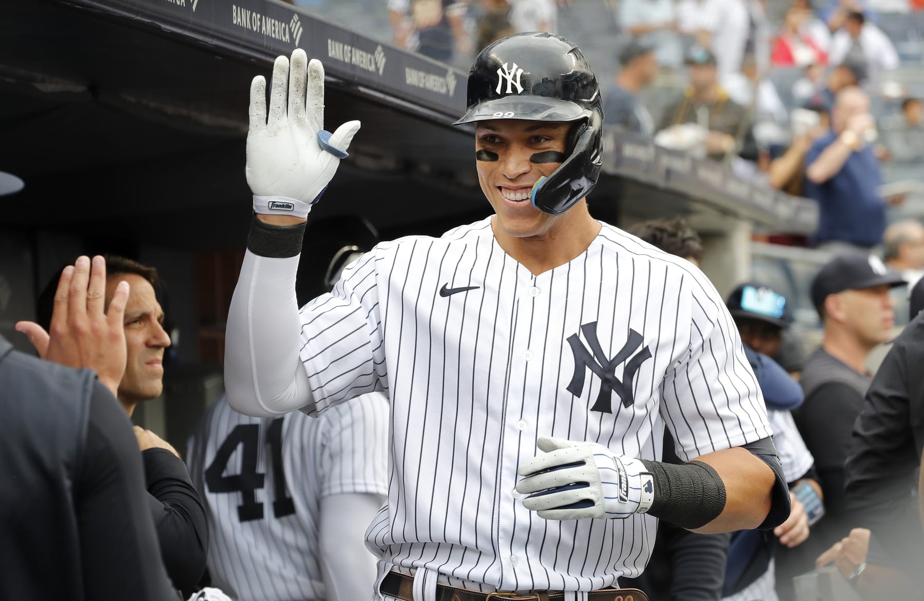 NEW YORK, NEW YORK - SEPTEMBER 07:  Aaron Judge #99 of the New York Yankees celebrates his fourth inning home run  during game one of a doubleheader against the Minnesota Twins in the dugout with his teammates at Yankee Stadium on September 07, 2022 in the Bronx borough of New York City. (Photo by Jim McIsaac/Getty Images)