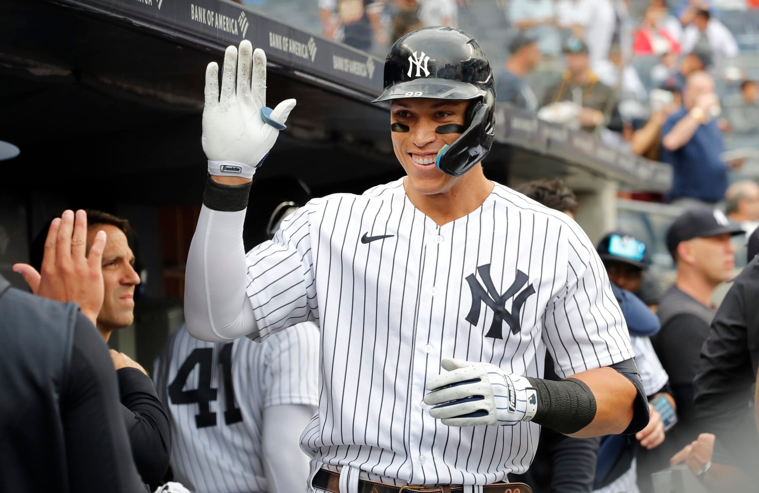 NEW YORK, NEW YORK - SEPTEMBER 07:  Aaron Judge #99 of the New York Yankees celebrates his fourth inning home run  during game one of a doubleheader against the Minnesota Twins in the dugout with his teammates at Yankee Stadium on September 07, 2022 in the Bronx borough of New York City. (Photo by Jim McIsaac/Getty Images)