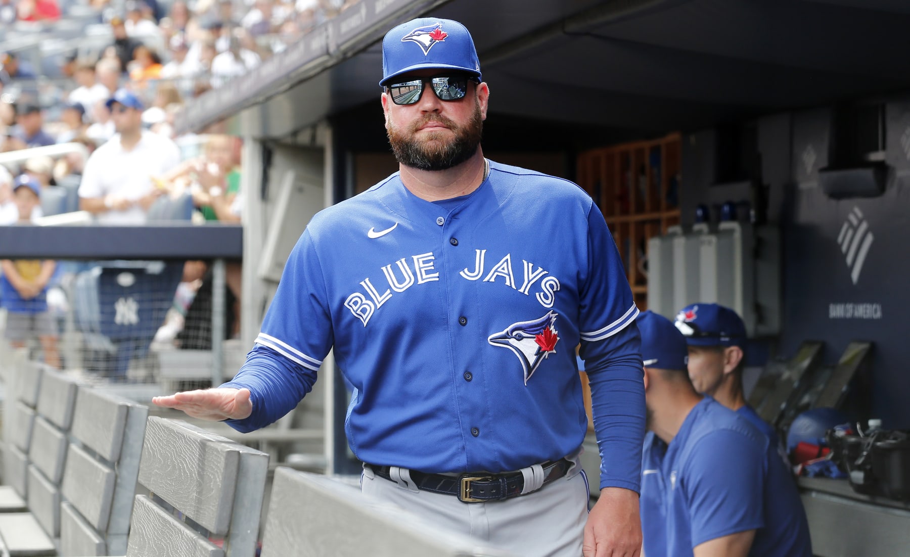NEW YORK, NEW YORK - AUGUST 21:  Manager John Schneider #14 of the Toronto Blue Jays looks on before a game against the New York Yankees at Yankee Stadium on August 21, 2022 in New York City. The Yankees defeated the Blue Jays 4-2. (Photo by Jim McIsaac/Getty Images)