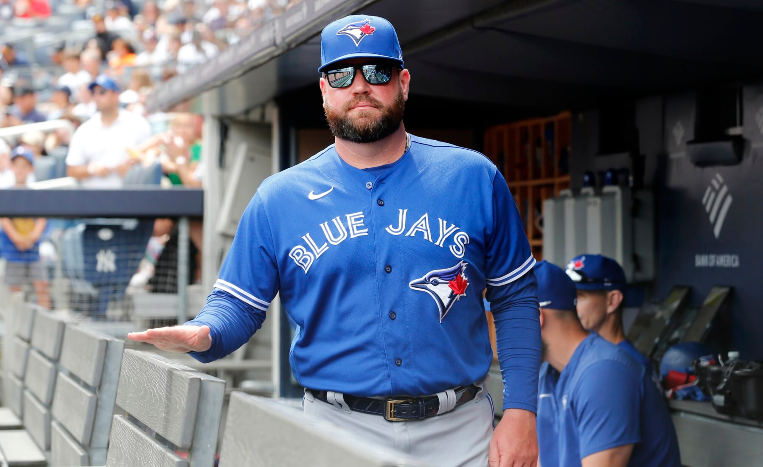 NEW YORK, NEW YORK - AUGUST 21:  Manager John Schneider #14 of the Toronto Blue Jays looks on before a game against the New York Yankees at Yankee Stadium on August 21, 2022 in New York City. The Yankees defeated the Blue Jays 4-2. (Photo by Jim McIsaac/Getty Images)