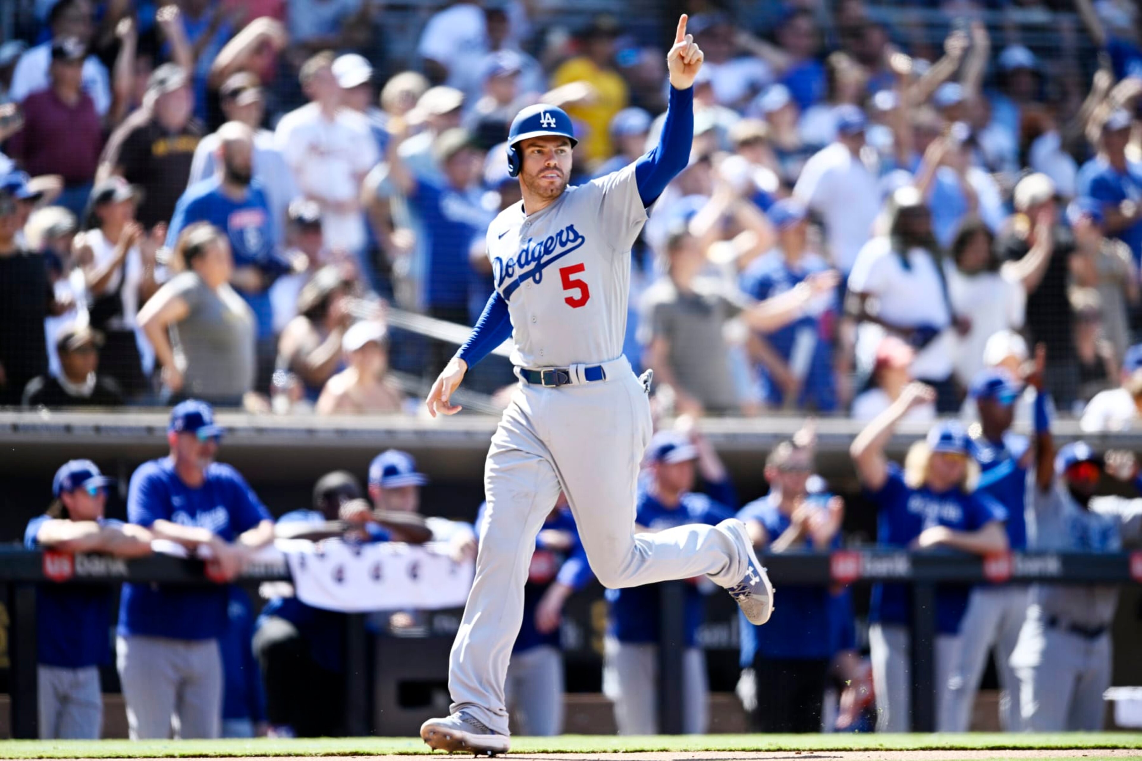 SAN DIEGO, CA - SEPTEMBER 11: Freddie Freeman #5 of the Los Angeles Dodgers celebrates as he scores during the sixth inning of a baseball game against the San Diego Padres September 11, 2022 at Petco Park in San Diego, California. (Photo by Denis Poroy/Getty Images) SAN DIEGO, CA - SEPTEMBER 11: Freddie Freeman #5 of the Los Angeles Dodgers celebrates as he scores during the sixth inning of a baseball game against the San Diego Padres September 11, 2022 at Petco Park in San Diego, California. (Photo by Denis Poroy/Getty Images)