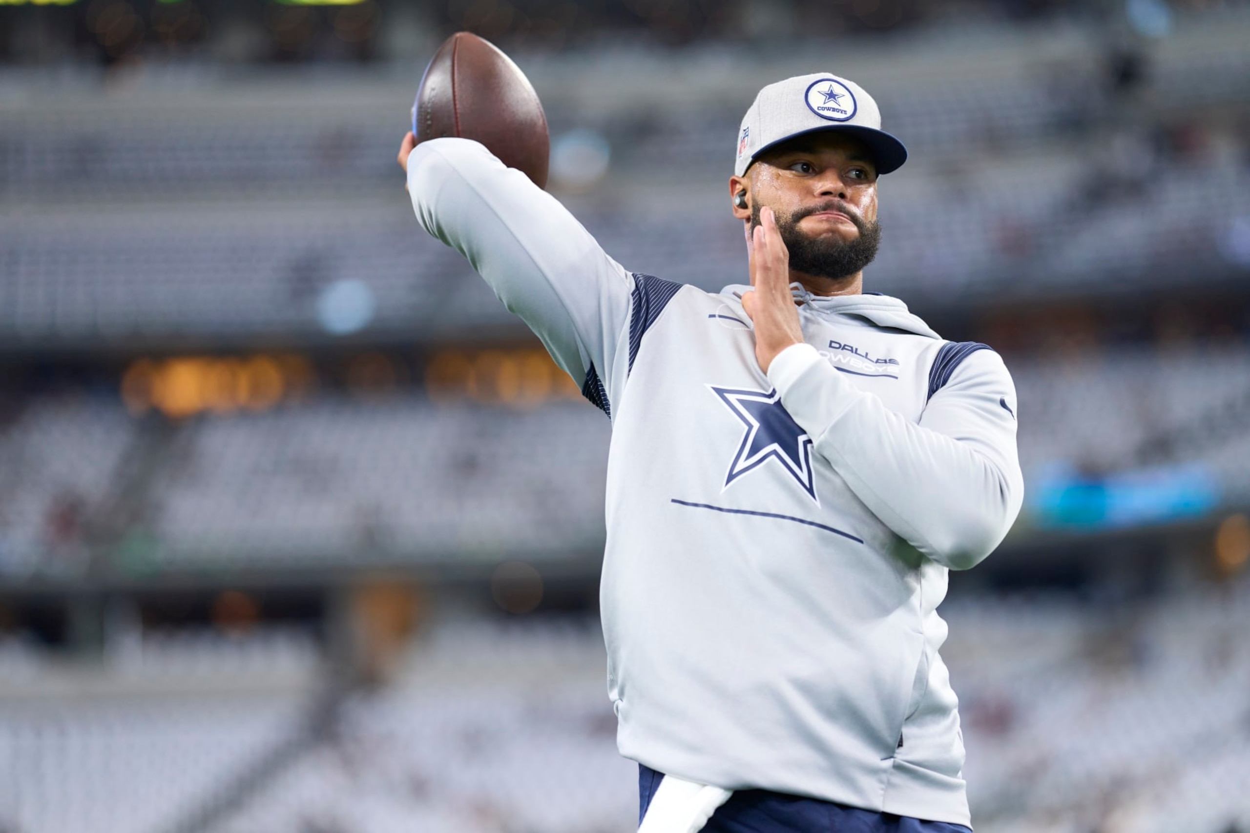 ARLINGTON, TX - SEPTEMBER 11: Dak Prescott #4 of the Dallas Cowboys warms up before kickoff against the Tampa Bay Buccaneers at AT&T Stadium on September 11, 2022 in Arlington, TX. (Photo by Cooper Neill/Getty Images)