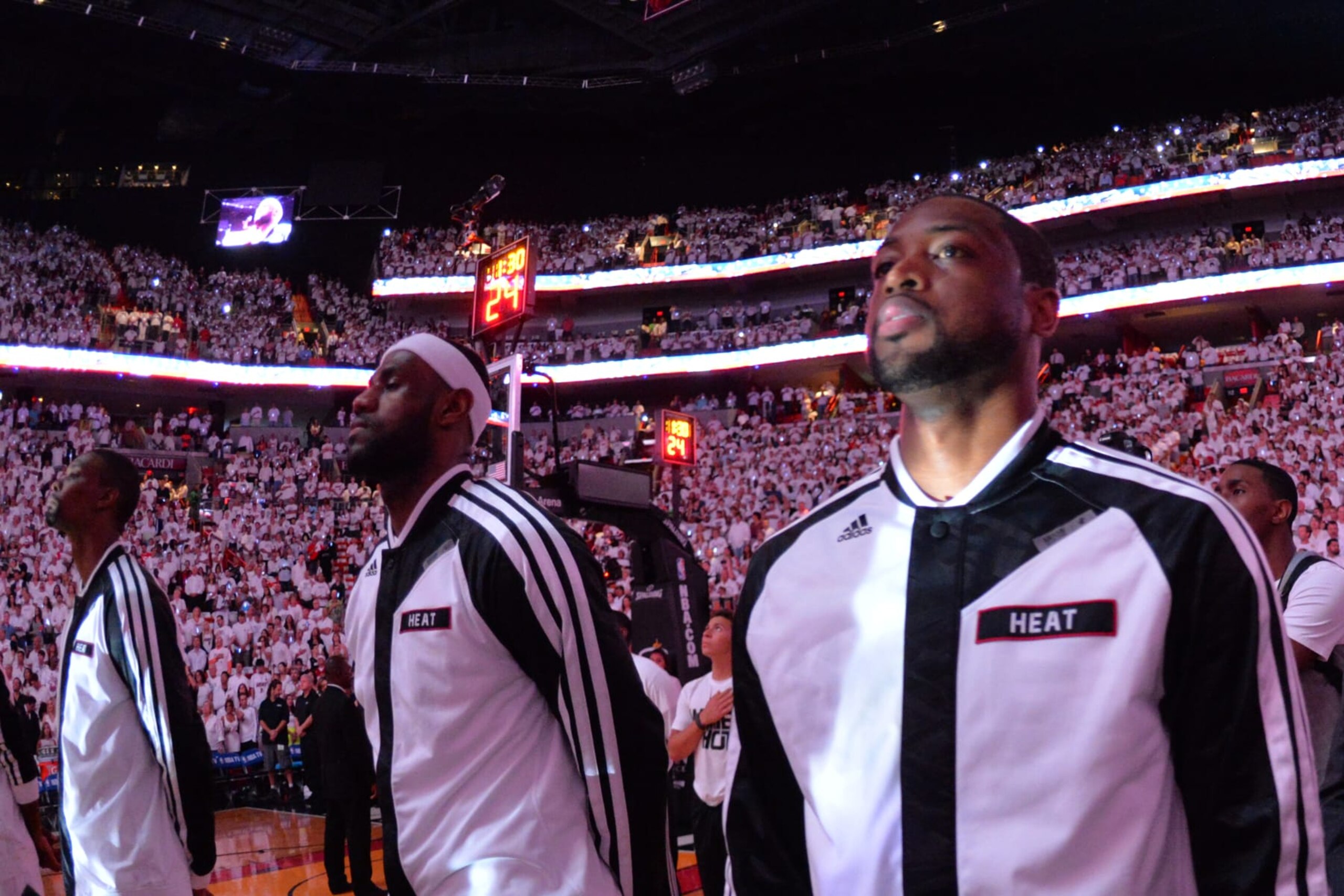 MIAMI, FL - MAY 30:  LeBron James #6 and Dwyane Wade #3 of the Miami Heat look on during the national anthem against the Indiana Pacers in Game Six of the Eastern Conference Finals during the 2014 NBA Playoffs on May 30, 2014 in Miami, Fl. NOTE TO USER: User expressly acknowledges and agrees that, by downloading and or using this photograph, User is consenting to the terms and conditions of the Getty Images License Agreement. Mandatory Copyright Notice: Copyright 2014 NBAE  (Photo by Jesse D. Garrabrant/NBAE via Getty Images)