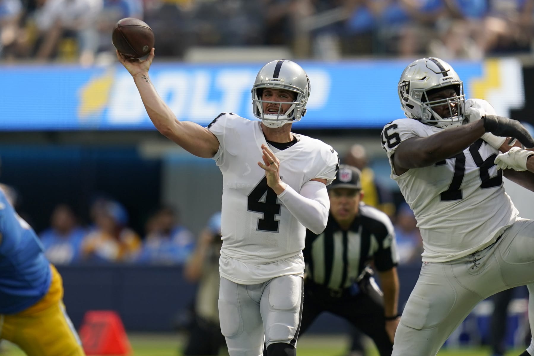 Las Vegas Raiders quarterback Derek Carr (4) passes against the Los Angeles Chargers during an NFL football game in Inglewood, Calif., Sunday, Sept. 11, 2022. (AP Photo/Gregory Bull)