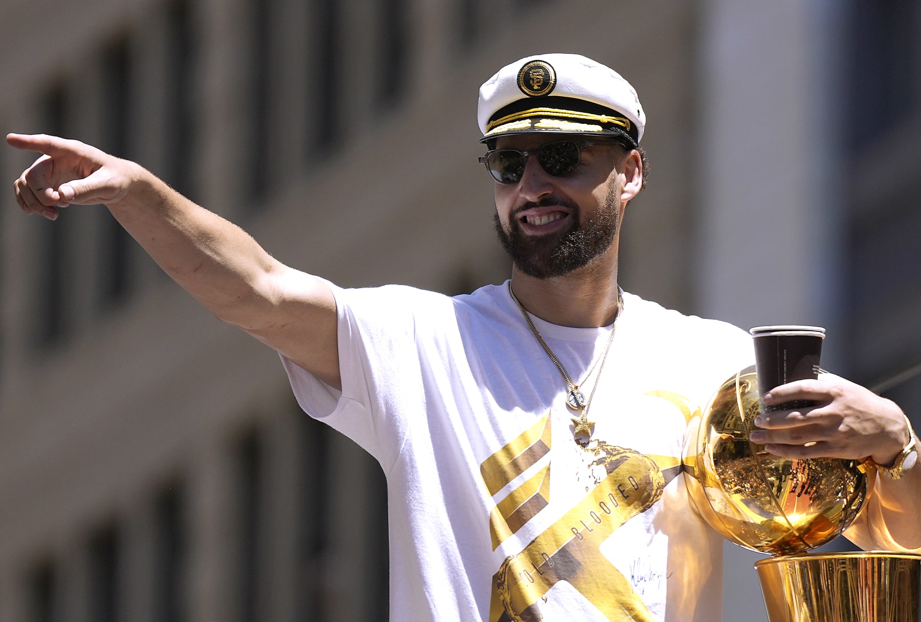 SAN FRANCISCO, CALIFORNIA - JUNE 20: Klay Thompson #11 of the Golden State Warriors celebrates with the NBA Championship Trophy during the Golden State Warriors Victory Parade on June 20, 2022 in San Francisco, California. The Golden State Warriors beat the Boston Celtics 4-2 to win the 2022 NBA Finals. NOTE TO USER: User expressly acknowledges and agrees that, by downloading and or using this photograph, User is consenting to the terms and conditions of the Getty Images License Agreement. (Photo by Thearon W. Henderson/Getty Images)(Photo by Thearon W. Henderson/Getty Images)