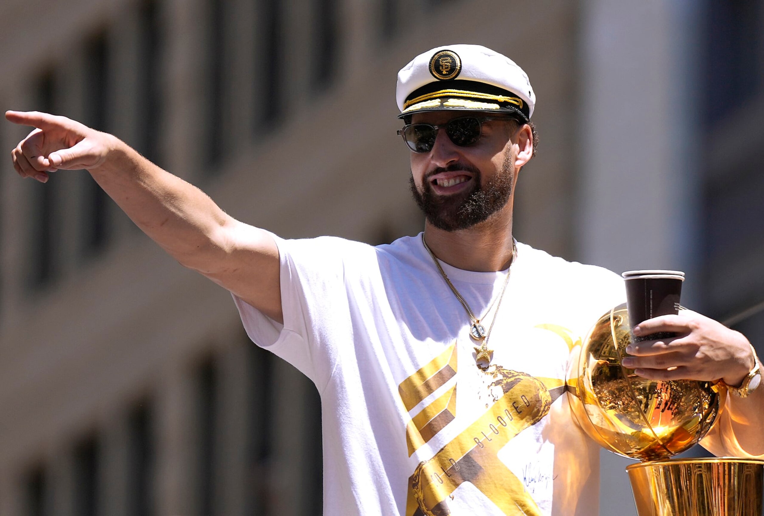 SAN FRANCISCO, CALIFORNIA - JUNE 20: Klay Thompson #11 of the Golden State Warriors celebrates with the NBA Championship Trophy during the Golden State Warriors Victory Parade on June 20, 2022 in San Francisco, California. The Golden State Warriors beat the Boston Celtics 4-2 to win the 2022 NBA Finals. NOTE TO USER: User expressly acknowledges and agrees that, by downloading and or using this photograph, User is consenting to the terms and conditions of the Getty Images License Agreement. (Photo by Thearon W. Henderson/Getty Images)(Photo by Thearon W. Henderson/Getty Images) SAN FRANCISCO, CALIFORNIA - JUNE 20: Klay Thompson #11 of the Golden State Warriors celebrates with the NBA Championship Trophy during the Golden State Warriors Victory Parade on June 20, 2022 in San Francisco, California. The Golden State Warriors beat the Boston Celtics 4-2 to win the 2022 NBA Finals. NOTE TO USER: User expressly acknowledges and agrees that, by downloading and or using this photograph, User is consenting to the terms and conditions of the Getty Images License Agreement. (Photo by Thearon W. Henderson/Getty Images)(Photo by Thearon W. Henderson/Getty Images)