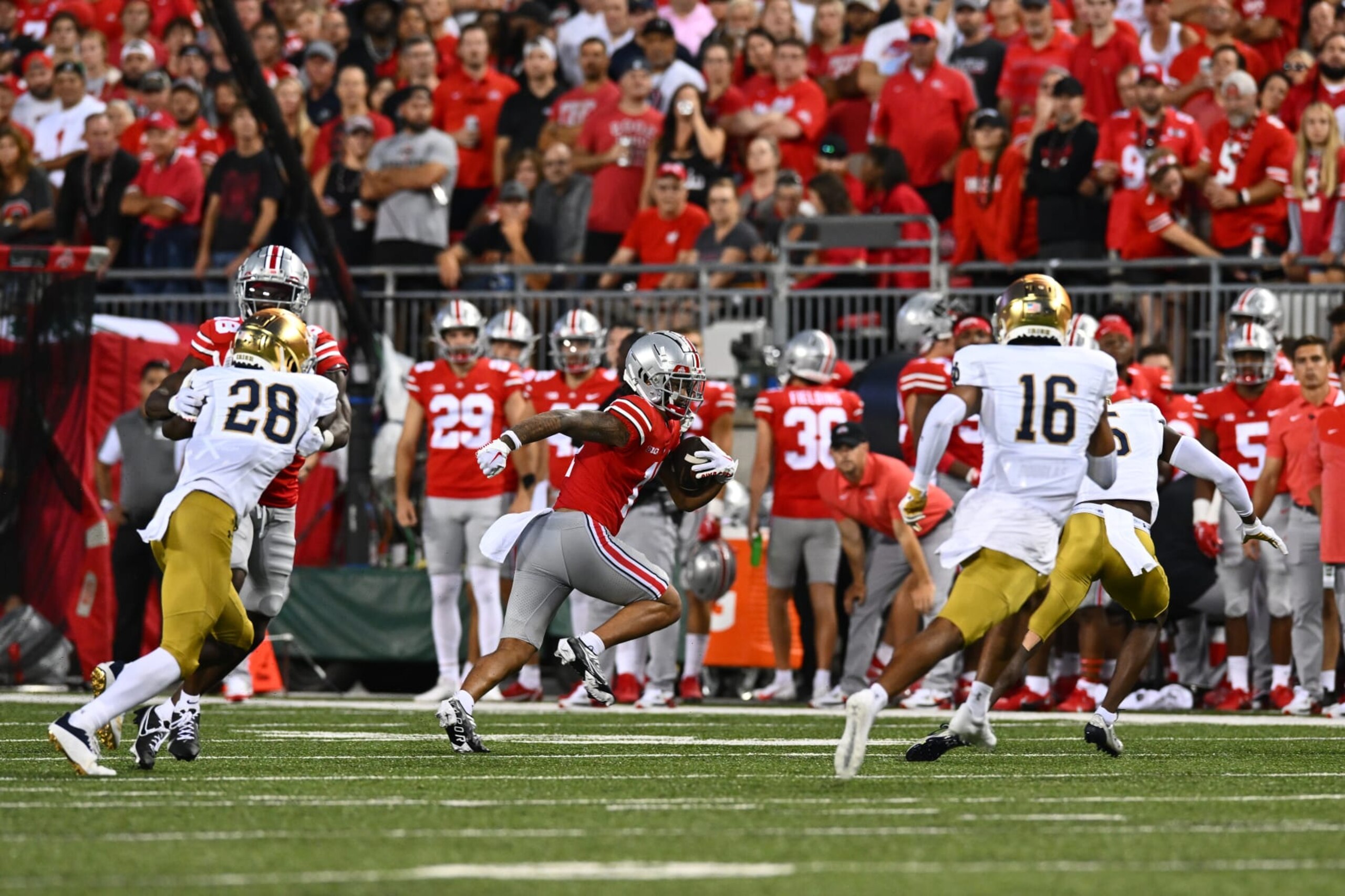 COLUMBUS, OHIO - SEPTEMBER 03: Jaxon Smith-Njigba #11 of the Ohio State Buckeyes runs with the ball during the first quarter in a game against the Notre Dame Fighting Irish at Ohio Stadium on September 03, 2022 in Columbus, Ohio. (Photo by Ben Jackson/Getty Images)
