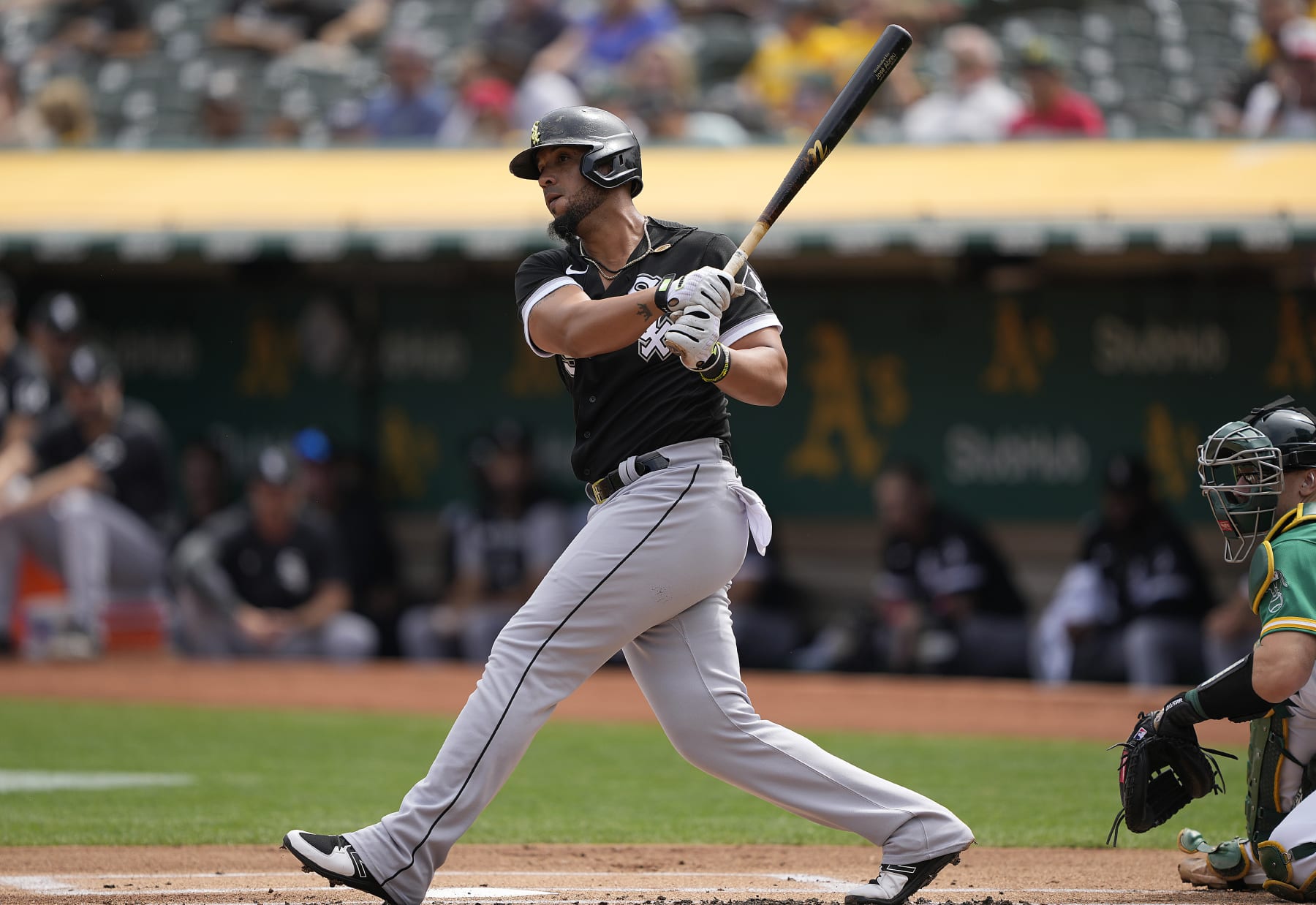 OAKLAND, CALIFORNIA - SEPTEMBER 11: Jose Abreu #79 of the Chicago White Sox hits an rbi double scoring Andrew Vaughn #25 against the Oakland Athletics in the top of the first inning at RingCentral Coliseum on September 11, 2022 in Oakland, California. (Photo by Thearon W. Henderson/Getty Images)