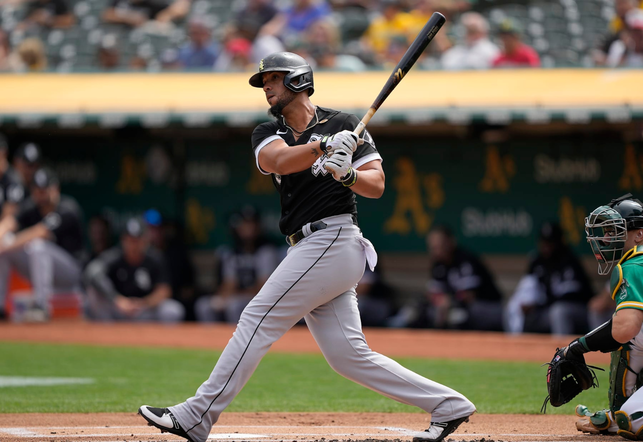 OAKLAND, CALIFORNIA - SEPTEMBER 11: Jose Abreu #79 of the Chicago White Sox hits an rbi double scoring Andrew Vaughn #25 against the Oakland Athletics in the top of the first inning at RingCentral Coliseum on September 11, 2022 in Oakland, California. (Photo by Thearon W. Henderson/Getty Images)